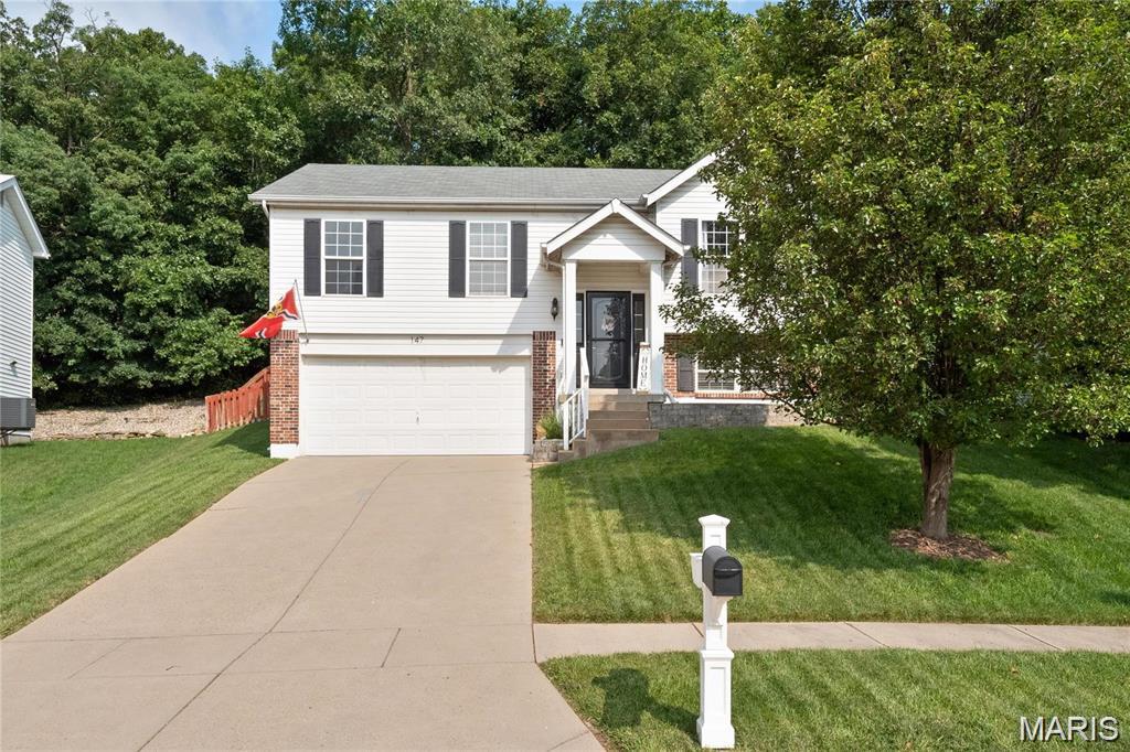 Back on market- no fault of seller.  This beautifully maintained 4-bedroom is nestled into a quiet cul-de-sac in the sought-after Hunters Green neighborhood. This home features soaring vaulted ceilings, a cozy gas fireplace and an updated eat-in kitchen complete with stainless-steel appliances. Two renovated bathrooms on the main level add modern appeal, while the finished lower level offers a rec room, full bath and additional bedroom or home office. Step outside to a fully fenced back yard designed for gathering and privacy. Take advantage of the neighborhood amenities, including a nearby lake for catch and release fishing, a playground and a picnic pavilion just a short stroll away. With updates that include a newer roof and AC, and a location in Rockwood School District, this home truly has it all.