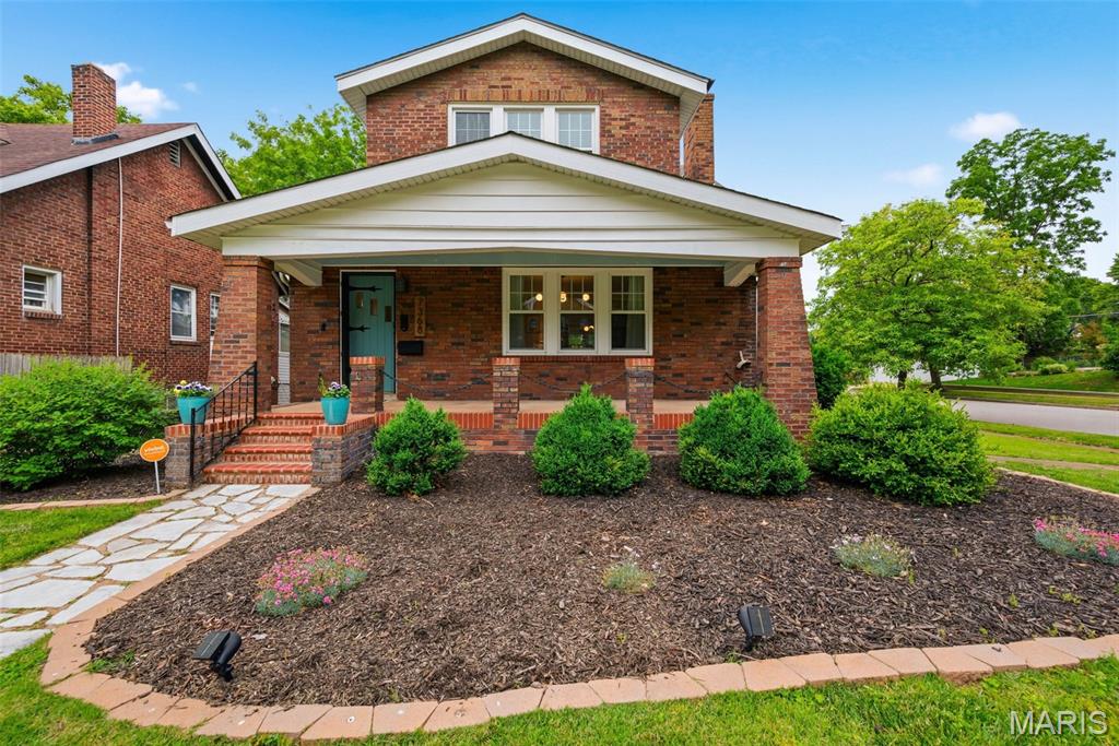 Welcome to this adorable brick bungalow that sits on a spacious corner lot in the desirable Musick neighborhood and features an oversized two car garage. A large, welcoming front porch sets the tone as you step inside. You are greeted with beautiful hardwood floors and warm natural light throughout. The charm of the main level offers stained glass windows, a cozy living room with a brick fireplace, a generously sized dining room with built in cabinet perfect for gathering and an updated kitchen ideal for preparing your favorite meals. Relax and enjoy your meals in the bright sunroom which boasts a wood plank ceiling overlooking the backyard. Upstairs, the roomy primary bedroom includes two walk-in closets, along with an accent wall.  Across the hall are two additional bedrooms.  Each room has its own style. Hardwood floors in all bedrooms.  The beautifully updated full bath completes the upper level.  The walkout basement provides plenty of space and storage. Outside, relax on the deck or gather around the firepit in the expansive fenced backyard—perfect for entertaining or unwinding. With quick access to Highway 170 and just minutes from Target, Dierbergs, Costco and Clayton’s restaurants, shopping, and entertainment. This beautiful home offers both comfort and convenience. This home is ready for you. Say “Yes” to 7368 Melrose Ave., St. Louis, MO  63130.