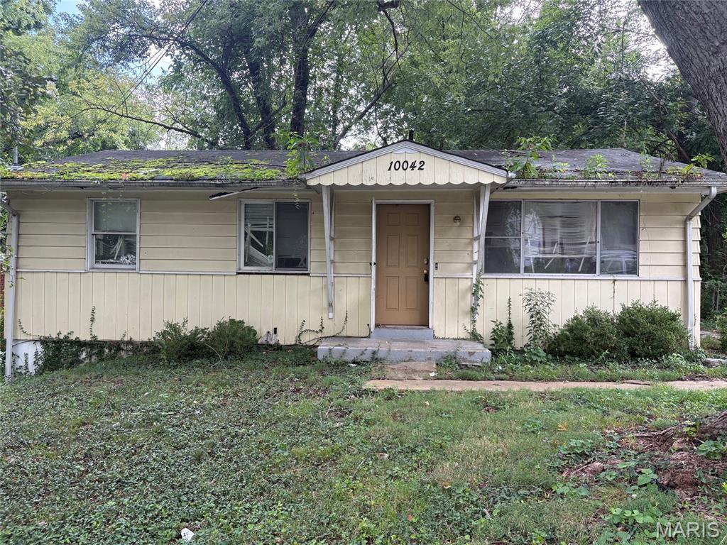 Great investment property with this ranch style 3 bedroom, 1 bath home offered in current as-is condition with no repairs to be made. Includes a wood-burning fireplace in the living/dining room and a full basement. Located close to public transportation, shopping centers and restaurants. Come check out what this home has to offer to transform into a great starter home!