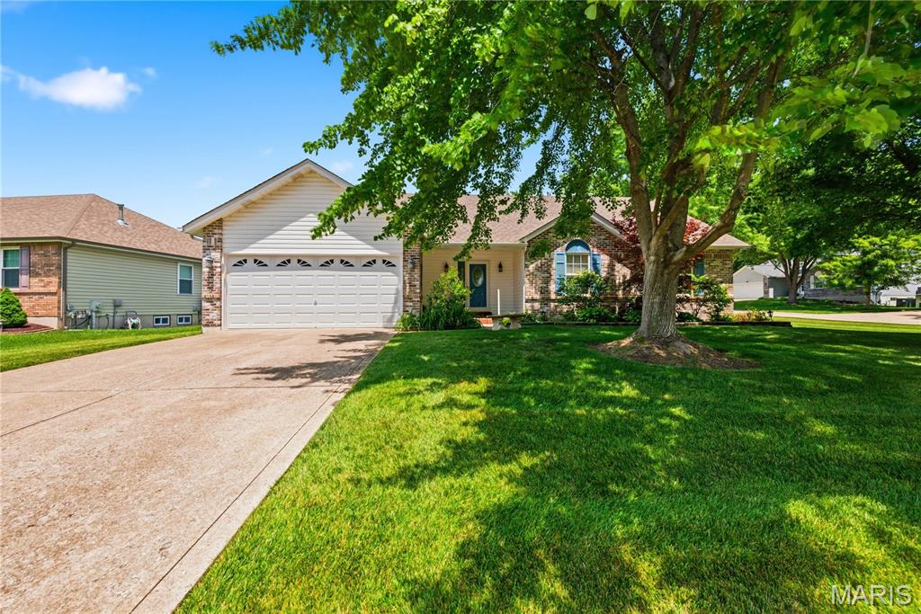 This spacious and open great room ranch home is conveniently located, close to restaurants, shopping, parks, and fantastic schools. Updates and upgrades galore with a bright and open feel! It features spacious bedrooms, open vaulted living space with fireplace, enclosed three season room, main floor laundry and upgraded gourmet kitchen! Special amenities include: wood floors, vaulted ceiling, updates to main floor bathrooms, custom cabinets, great room with fireplace,  recessed lights, three full bathrooms, sun room off the back make it bright and cozy! Kitchen upgraded custom cabinets with crown molding, granite counter tops, island and much more! Main floor primary bedroom with en-suite, large shower with built-in seat and walk in closet. Exterior features vinyl siding, enclosed soffits and fascia, oversized two car garage for storage, inground irrigation system, brick patio off back on a corner lot.  This beautiful home is gorgeously finished and sits in a very desirable community. The three season room adds living space not typically found in homes in the subdivision. Schedule your private showing today!