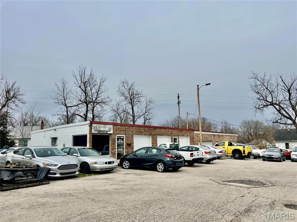 LOOKING FOR A PERFECT LOCATION FOR YOUR SHOP ?   THIS PROPERTY CURRENTLY USED AS A CAR LOT OFFERS MANY POSSIBILITIES.  7 BAY GARGE - SHOP, OFFICE RETAIL SPACE. 2 BATHS, THE GARAGE COULD BE CONVERTED AS WELL TO RETAIL SPACE.  CORNER LOT WITH EXTRA SPACE TO EXPAND.    BLACK TOP PARKING.  BRICK FRONT.  2968 SQ FT BUILDING.   LARGE ASPHALT PARKING LOT. NEW FURNACE IN MAIN BUILDING. Location: Downtown, High Traffic