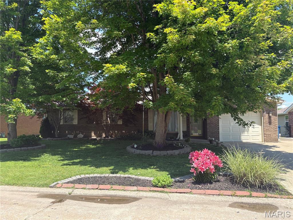 Well-maintained brick ranch featuring 3 bedrooms and 2 full baths and large laundry room. This inviting home offers a bright sunroom, a cozy brick fireplace, and comfortable single-level living. A solid, charming property with great warmth and character.