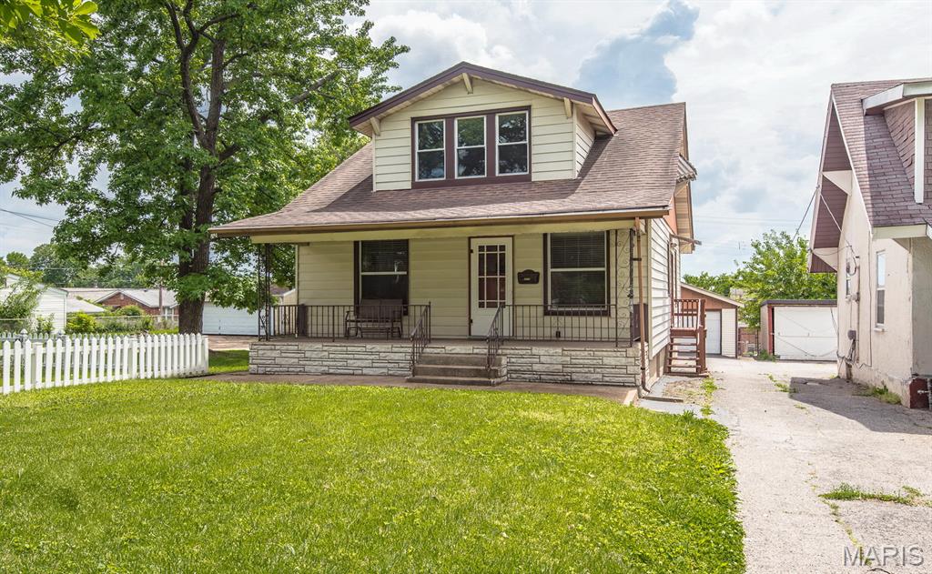 OPEN SUN 11-1PM! Welcome HOME to this beautiful South City Charmer - 3 bedrooms, 2 full bath home with a detached two-car garage, covered front porch, big Lower Level and a HUGE city lot! Inviting front welcomes you to the inside of this meticulously maintained story-and-a-half home in Dutchtown offering classic South City charm and SO much room. You'll love the large living room as you enter. The kitchen has ample amount of cabinets, custom built-in, stainless steel appliances and connects you to your big back porch. Charming main floor bedroom with stained glass windows. Full bath with original tiles and an office/ bonus room complete the main level. Upper level includes two large sized bedrooms with walk-in closet space and a full bathroom with a tub. Lower level has a walk out and is a full basement with washer/dryer hookups, utility sink, workbench and multiple storage areas. HVAC fully replaced in 2022! Home is set back from the street with a large front yard and mature shade tree. Shared driveway easement leads to detached oversized 2-car garage, additional rear parking pad and backyard space. Move-in READY for you - comes with a passed occupancy AND a Home Warranty! Tucked away, yet incredibly convenient -you’re less than 5 minutes to I-55 & all major highways, within walking distance to Urban Eats Food Hall on Meramec, close to all the best restaurants, shops & parks St Louis City has to offer. CALL NOW
