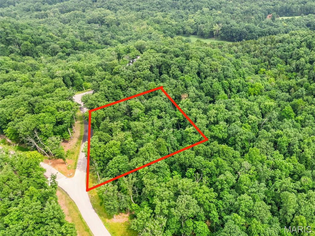 Rare Double-Lot Opportunity in the Heart of Innsbrook!
An incredible opportunity awaits with this stunning 2.03-acre homesite — and the neighboring lot is also available, creating the potential for an expansive 4.05-acre private retreat. Nestled among towering hardwoods and set on gently elevated terrain, this property offers sweeping treetop views and a serene, secluded atmosphere. Designed with Innsbrook’s signature Treehouse concepts in mind, this lot is the perfect canvas for a home that feels suspended above the forest floor — blending modern comfort with the beauty of nature. Imagine relaxing on your deck, surrounded by lush woodland and panoramic vistas in every direction. Located in the desirable Tyrolean area, this homesite benefits from a private entrance gate and close proximity to Charrette Creek Commons, scenic lakes, the Tyrolean Nature Trail, and the newly completed pool complex. Whether you’re seeking a peaceful full-time residence or a weekend sanctuary away from it all, this property offers endless potential to bring your vision to life.
