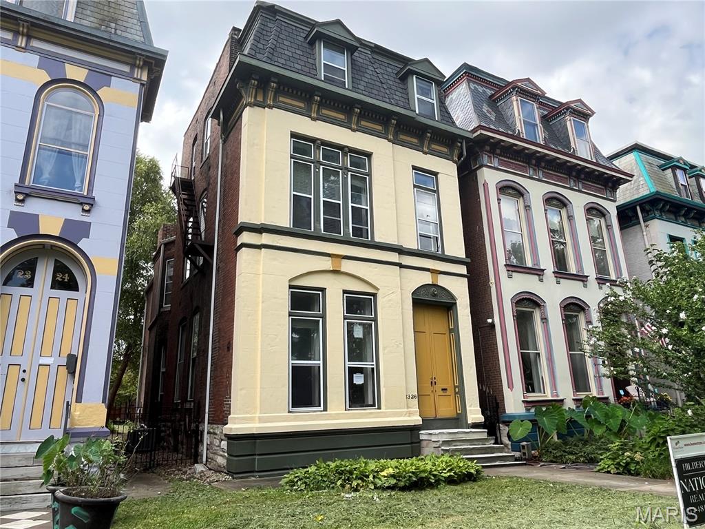 Multiple offers; Submit High/Best contract by Monday at 12noon.  Massive equity project at 2326 Park Ave in historic Lafayette Square! Listed at $599,900 with a recent certified appraisal validating a $1,000,000 completed market value. Zoned duplex, this 1881 estate features a 3,738 sq ft main house and a separate, finished 639 sq ft carriage house apartment over a 2-car garage. Save months of planning and municipal paperwork: fully engineered design plans and prior approved city permits are included to complete a luxury layout. Main house layout features 3 second-level ensuite suites and upper laundry. The third-story retreat features a 4th bedroom suite, private lounge area, and structural rooftop deck access. Plans address heavy infrastructure, including a 400-AMP service panel and dual 4-ton heat pumps. Pick your final finishes and leverage a $400K spread to complete a historic masterpiece!