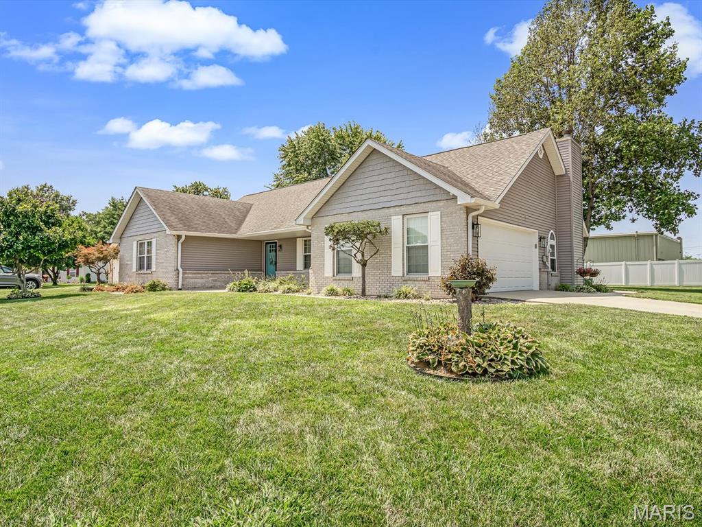 Style, space and versatility come together in this beautifully updated ranch! The wall between the living room and kitchen has been removed to create a bright, open gathering space accented by warm wood details. The show-stopping kitchen offers custom cabinetry, a large island, brick backsplash, abundant storage, a spacious sink and stainless appliances. An adjoining dining area features additional built-in cabinetry and opens to the covered patio. Relax in the separate family room with its vaulted ceiling, abundant natural light and former wood-burning fireplace now fitted with an electric insert. Three main-level bedrooms include a spacious primary suite with a walk-in closet and private bath, while the updated guest bathroom adds modern style. The expansive finished lower level provides flexible space for recreation, hobbies, an office or overnight guests, along with a half bath and ample storage. The laundry room includes a built-in laundry-basket organizer, countertop and upper cabinets; washer and dryer stay. Outside, enjoy attractive landscaping, a covered patio, firepit and dedicated grilling area, plus a 10x16 shed situated on a poured concrete pad. The windows, siding, roof, HVAC system and garage door have all been replaced, while oversized gutters add even more appeal. This move-in-ready home offers room to gather, work, relax and entertain!