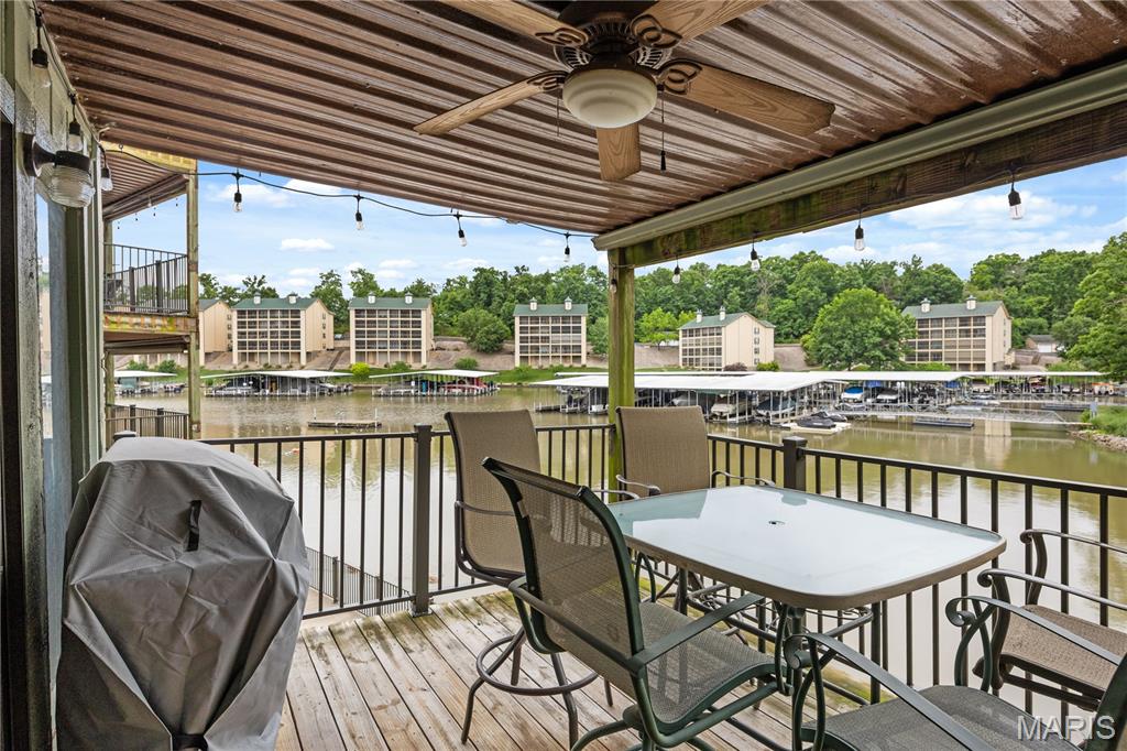 Experience lakefront living at its finest in this immaculate 2-bedroom, 2-bath condo in the highly sought-after Southwood Shores community of Lake Ozark. Nestled in Building 149, this turn-key unit provides prime cove protection and a spacious, inviting layout perfect for immediate enjoyment. The interior shines with newer flooring and freshly painted kitchen cabinets that add a stylish, modern touch. Step outside to an awesome covered deck ideal for relaxing or entertaining guests. This property comes complete with the ultimate Lake Life Package: a 12x28 boat slip, a PWC slip, and a brand-new hoist! Southwood Shores offers unmatched resort-style amenities, including a clubhouse, indoor and outdoor pools, a hot tub, tennis and basketball courts, a playground, designated lake swimming areas, trailer parking, and a convenient boat ramp. With nightly rentals allowed, this versatile turn-key condo makes a fantastic investment opportunity, a premier part-time vacation getaway, or a full-time residence surrounded by top-tier amenities. Don’t miss your chance to own a piece of paradise—experience it now via the interactive virtual tour and schedule your private showing today!