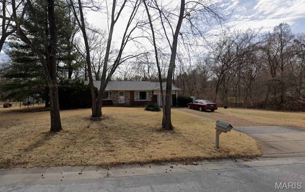 Opportunity awaits with this three-bedroom ranch situated on a level, one-acre lot on a cul-de-sac in the Marquette High School district. Offering approximately 1,325 square feet of living space, the home features an attached one-car garage, full basement and hardwood flooring believed to be under many of the carpeted areas. A large picture window fills the living room with natural light, while the family room features a corner fireplace. The kitchen provides access to a small deck and the expansive backyard. The home retains many of its original finishes and is ready for renovation and updating, offering an appealing opportunity for an investor, renovator or buyer looking to create value. Property is being sold in its current condition; seller will make no repairs. Some personal property and other items may remain at closing.  Note:  Property is in a 500 year flood plain (vs 100 year), but does NOT federally require flood insurance.