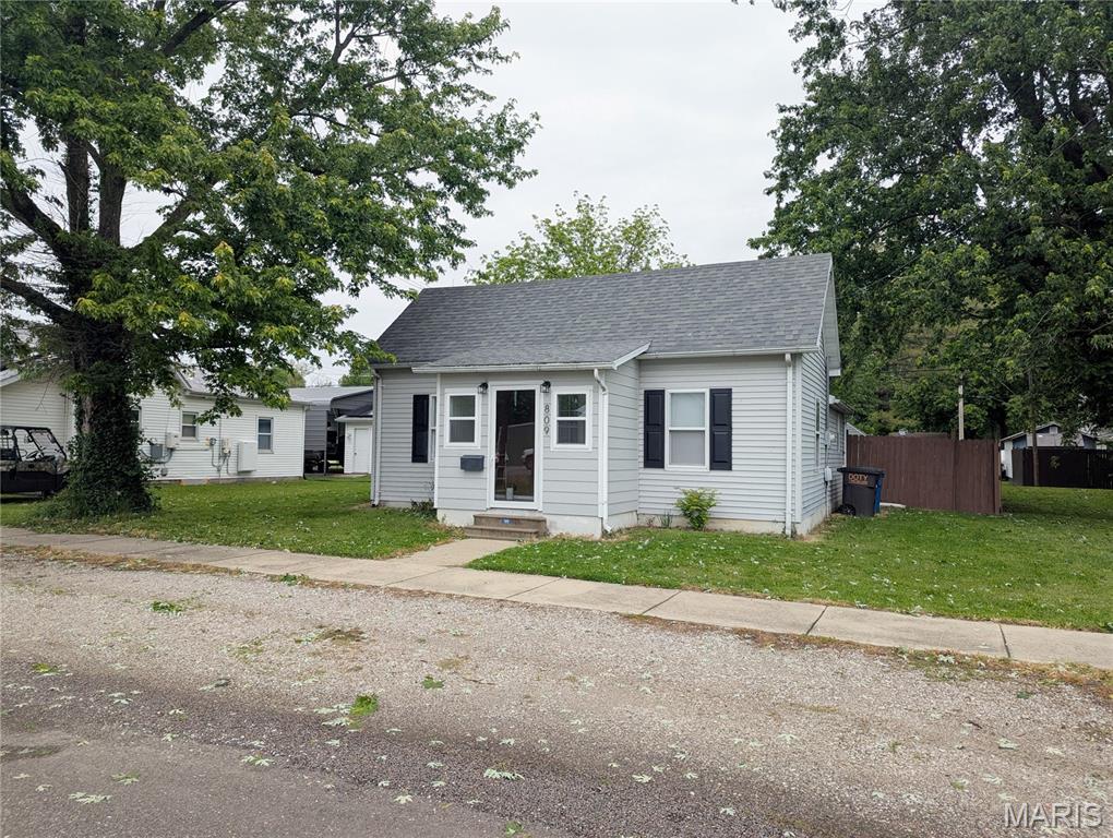Cute and completely updated and now with a BRAND NEW ROOF? That’s the winning combo. This 2 bed, 1 bath charmer was fully renovated in 2024, and it still feels fresh out of the makeover montage. From the updated fixtures and flooring to the luxe kitchen with stainless steel appliances and solid surface countertops, every inch feels polished, stylish, and ready for your unique touches.

The eat-in kitchen has room for an actual table, because cereal over the sink is not a lifestyle requirement here. Whether it’s weeknight takeout, Sunday pancakes, homework sessions, or hosting your friends for questionable craft nights, this space works for real life.

The enclosed front porch/sunroom is basically begging to become your plant haven, reading retreat, coffee spot, or all three at once.

You’ll also love the main-floor laundry nook tucked conveniently off the kitchen, complete with washer and dryer that stay with the home. Downstairs, the full basement gives you tons of storage space for holiday décor, tools, hobby gear, and the bins of things you swear you’ll organize someday.

And then there’s the backyard. Fully fenced, generously sized, and ready for dogs, bonfires, gardens, backyard games, or chaotic summer BBQ energy.

Stylish, functional, and full of warmth, this home makes “move-in ready” feel a lot less boring.