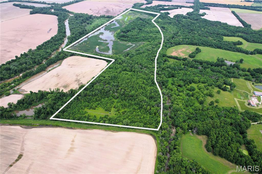If you’re looking for a serious hunting property in North Missouri, this 172 acre tract near Wheeling deserves a look. Located in Livingston County, this property offers outstanding habitat for whitetail deer, turkey, and waterfowl.
Water is a major feature of this farm, with Muddy Creek bordering the east side and Medicine Creek running through the property. The combination of creek corridors, cover, wetlands, and protected habitat creates excellent conditions for holding and traveling wildlife. Waterfowl hunters will greatly appreciate being near Fountain Grove Conservation Area, with more than 8,000 acres of managed wetland habitat nearby. 
The property is already set up for hunting with multiple elevated blinds and an established trail system providing access throughout the acreage. Whether you’re chasing mature North Missouri whitetails, spring gobblers, or migrating waterfowl, this farm offers multiple recreational opportunities throughout the year.
The acreage is enrolled in a lifetime WRP conservation program, helping preserve the wildlife habitat and natural character of the property for generations to come.
* Coordinates- 39.80452 -93.41422 takes you to easement entrance