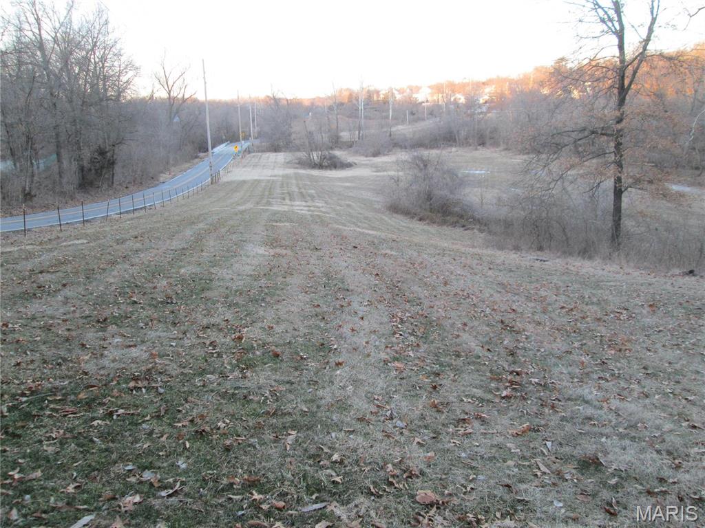 Perfect lot to build a custom home among the Eagles, deer, turkey, fox, owls and many other wildlife. Location... Location.. Location! This 3.54+/- acre parcel has utilities at the site and is ready to build. This site offers so many possibilities so just use your imagination. It would be perfect for someone with horses or that would like to have them as there is a huge area of pasture for them to run. Feels like you're in the country yet just a mile from shopping, main interstate, etc.. This site also offers some excellent hunting opportunities like no other as several monster deer have been harvested over the years. Plus NO HOA to deal with. Sewer, water, gas, electric & cable are already on same side of the street and sewer tap has already been paid for.