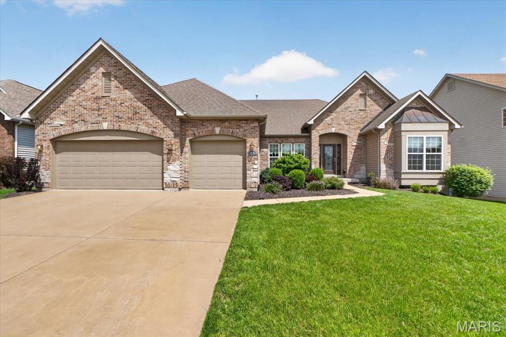 Welcome to 1220 Talbridge Way, a beautifully updated ranch offering over 4,100 square feet of finished living space designed for both everyday comfort and entertaining. Just inside the entry, a dedicated room provides a great space for a home office, game room, or additional living area. From there, the home opens into a spacious main living area featuring 9-foot ceilings, rich wood flooring, and an open layout. The great room is a standout with soaring 12-foot ceilings, a gas fireplace, and a wall of windows that fills the space with natural light. The kitchen is equally impressive with granite countertops, 42-inch cabinetry, stainless appliances, a large center island, and breakfast bar seating. A separate area just off the main living space offers an ideal spot for a TV room or additional lounge. The main level also includes a private primary suite with a custom closet system and luxury bath, along with two additional bedrooms and a full bath. Main floor laundry adds everyday convenience. 
The finished walkout lower level expands the home even further with a large rec room, a well-appointed kitchenette with granite counters and stainless appliances, two additional bedrooms, two full baths, and a second laundry area, offering flexible living arrangements. 

Step outside to enjoy the professionally landscaped yard from the composite deck or relax on the patio below. The fenced backyard provides both privacy and usability. A three-car garage completes the home. Located in the Talbridge community with convenient access to shopping, dining, parks, and major routes, this home offers a great balance of neighborhood feel and everyday convenience.  Please continue to show for back-up offers