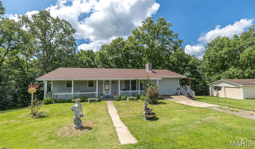 Tucked away on nearly 5 private acres, this spacious 4 bedroom, 1.5 bath home is full of potential! Recent updates include a new roof and deck in 2024, along with granite countertops in the kitchen. With solid bones and a well maintained interior, all that's left is to bring your paint brush and personal style to make this beauty truly shine. Outside, you'll find plenty of room for vehicles, hobbies, and storage with a **24' x 24' detached 2 car garage**, a **40' x 40' shop with 3 garage bays and hobby space, plus an additional carport. Enjoy the peaceful country setting while still having all the space you need to live, work, and play. The adjoining property is also available for purchase, creating a rare opportunity to own nearly **7.3 acres** as a private family compound, multigenerational retreat, or investment opportunity.