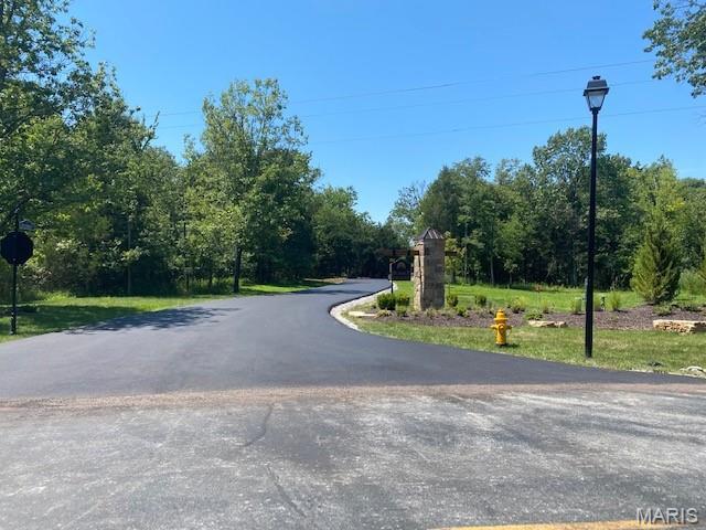Four Luxurious home sites, on 5 acre lots.  Sunset Estates in St. Charles County MO. Located in the heart of Defiance and wine country.  Bring your own builder/plans and build your dream home on one of these premium secluded, all wooded lots.  Homesites are located on a private street with cul-de-sac.  Homeowners will enjoy the peace and quiet, along with privacy. County water and high-speed internet. Minutes away from the Wineries, Katy Trail and Klondike Park. This is a rare opportunity to live in a private, small and secluded community away from all the Hussle and bustle.   To build the home of your dreams, the way you want it and not be forced to pick one from a big tract builder.