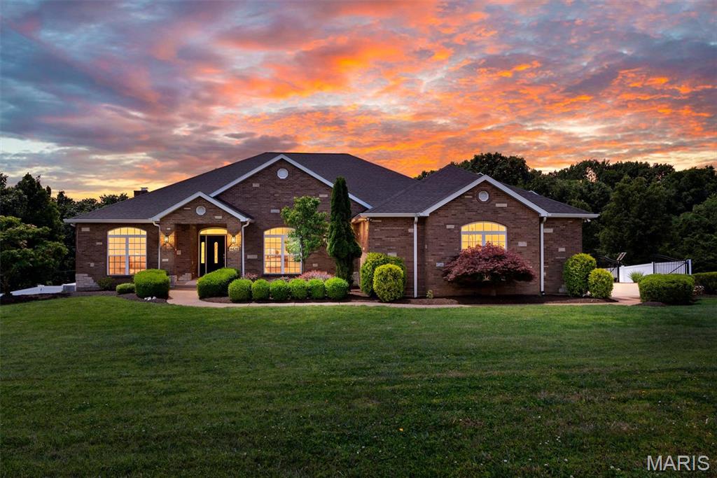 Own Your Own Private Retreat — Designed for Everyone, Built for Life
Tucked within the serene 3.25-acre wooded landscape of Riebold Farms, this exceptional ranch home blends universal accessibility with refined, everyday luxury — and it's completely move-in ready.
Step inside to soaring vaulted ceilings, sun-drenched common areas, and an open floor plan made for both quiet mornings and lively gatherings. The chef's kitchen and expansive breakfast room flow effortlessly into generous living and dining spaces where entertaining feels natural and effortless.
Thoughtful accessibility is woven throughout — a stepless entry, garage ramp, and interior elevator ensure comfort and independence for every stage of life. The primary wing offers a private ensuite retreat with multiple accessibility features, while three additional bedrooms and a full bath occupy the opposite wing for ideal separation and privacy. Main-floor laundry with abundant storage and a convenient powder room near the garage complete the layout.
Downstairs, the walkout lower level is nothing short of spectacular. A showpiece bar anchors the space, flanked by a game room, a family room with a stunning cut-stone fireplace, and a recreation room with endless possibilities. A bedroom, accessible curbless bath, and flex room — currently a gym — round out the level beautifully.
Outside, your backyard sanctuary awaits. Entertain around the sparkling saltwater pool, unwind in the fenced yard, or simply take in the breathtaking wooded views that make every moment feel like an escape.
Car enthusiast? Hobbyist? The detached 3-stall garage delivers — complete with a full bath and a finished upper-level space ready for whatever inspires you. A 2-stall attached garage adds even more versatility.
Meticulously maintained and truly turnkey — this is the one. Schedule your private showing today.

The following items convey with this home:
All installed speakers and TV mounts 
All blackout draperies 
Kitchen Island 
Mudroom/laundry appliances: refrigerator, freezer, washer, and dryer 
Whole house vacuum and accessories 
Kitchen refrigerator
Bar refrigerator, wine refrigerator, microwave, and small TVs 
Pool table and accessories 
Gun safe with key
Salt supply for water softener system 
Elevator tools
Hoist in detached lower garage 
Extra house materials and paint 
Pool equipment: safety cover, solar cover (new), nets, basket, and vacuum head, miscellaneous pool tools 
Ring doorbell and Ring motion detector spotlight at patio slider