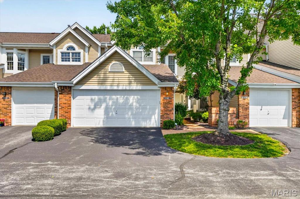 Welcome to this spacious townhome offering comfort, flexibility, and low-maintenance living in a desirable community.    Step inside to an inviting main living area featuring a large bay window that fills the space with natural light and a cozy fireplace that creates a warm focal point. The home flows seamlessly into a separate dining area and a well-positioned kitchen offering everyday functionality and ease of use.  The primary suite offers a spacious retreat with room for relaxation or additional seating, along with a flexible adjoining space ideal for a home office, reading nook, nursery, or sitting area. This suite also features two closets, including a large walk-in and a second standard closet for additional storage. The ensuite bath features a jetted tub and separate walk-in shower, creating a comfortable and private escape.  A second bedroom and full bath complete the main level, offering comfortable accommodations for guests or family.  The finished lower level expands the living space with a large recreation area and additional living space anchored by a second fireplace, plus another full bathroom—perfect for guests, hobbies, or extended living options.  A two-car garage provides convenient parking and additional storage, completing this well-rounded home. Priced to sell, this home offers a wonderful opportunity to personalize and enjoy a low-maintenance lifestyle in a sought-after location.  Enjoy the community tennis and pickleball courts, then cool off in the in-ground pool located just steps from your door.