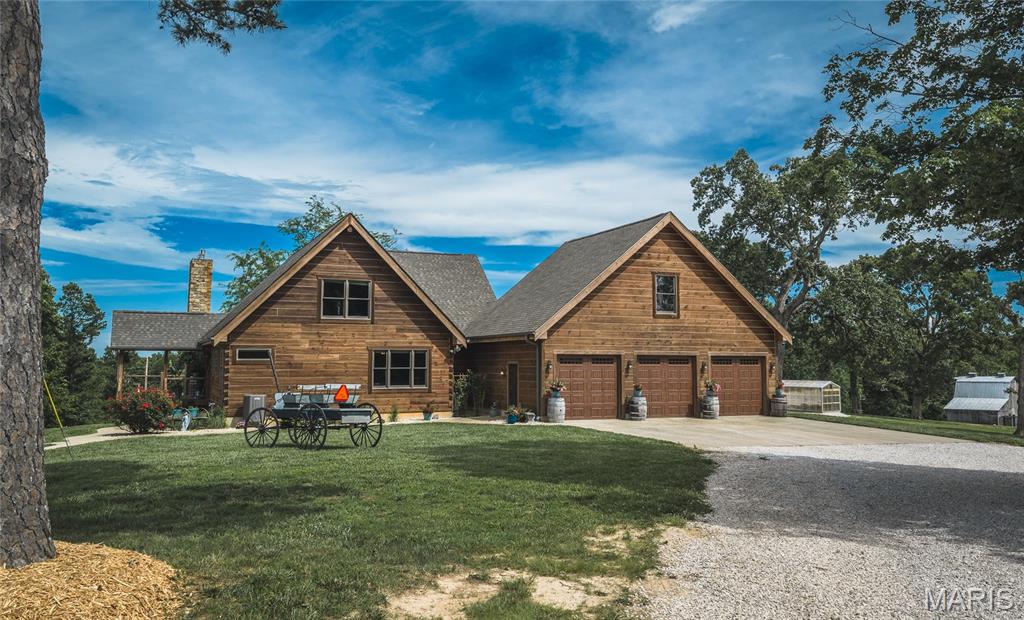 Located in southern Ste. Genevieve County along Hwy WW, this 140 +/- acre property offers a combination of pasture, timber, quality improvements, and recreational opportunities. Featuring a custom log home, multiple outbuildings, an established trail system, and hunting improvements, this property offers country living with exceptional recreational opportunities. The centerpiece of the property is the custom log home overlooking the surrounding pasture fields. Constructed with impressive wood and stone finishes throughout, the home blends rustic craftsmanship with spacious living areas. Offering four bedrooms, three full bathrooms, and two half bathrooms, the home provides ample space for everyday living and hosting family and friends. The main level features warm wood finishes, natural stone accents, and large windows overlooking the surrounding countryside. The finished walkout basement expands the living space and includes a custom bar area, making it an excellent place to gather. Just outside the walkout basement is an in-ground swimming pool, creating an inviting space for relaxing and entertaining. Additional improvements complement the home and provide exceptional functionality throughout the property. An attached three-car garage offers convenient parking and storage, while a detached two-car garage includes a walk-in cooler and a backup generator servicing the property. A 40 x 60 pole barn provides ample room for equipment, while four additional barns offer storage for machinery, hay, livestock equipment, and recreational gear. The 140 +/- acres feature an attractive blend of open pasture fields and timber, creating a landscape suited for agricultural and recreational uses. The pasture ground offers opportunities for grazing livestock or producing hay, while the wooded acreage provides excellent wildlife habitat and natural cover. A well-established trail system extends throughout the property, making it easy to access nearly every corner of the acreage. Whether traveling by ATV or UTV, checking fences, or heading to a hunting location, the trails provide convenient access throughout the property. Outdoor enthusiasts will appreciate the established hunting improvements already in place. Six box blinds are positioned throughout the property, offering ready-to-use hunting locations overlooking key travel corridors and feeding areas. The combination of timber, pasture, and established access creates favorable habitat for deer and turkey while making the property easy to navigate throughout the seasons. One of the property's standout features is its direct boundary with state-owned land. This provides convenient access to additional public acreage for hunting and other outdoor recreation, expanding opportunities beyond the property's 140 +/- acres. Combined with the trail system and hunting improvements, the neighboring public land further enhances the property's recreational appeal. Beyond hunting, the acreage offers plenty of room to enjoy hiking, trail riding, wildlife viewing, and other outdoor activities. The diversity of the landscape provides scenic views across the pasture fields while the timber offers privacy and a peaceful rural setting. Situated along Hwy WW, the property provides convenient year-round access while maintaining the quiet atmosphere of rural Ste. Genevieve County. The setting offers the feel of country living while remaining within a reasonable drive of nearby communities, shopping, schools, and everyday conveniences. Whether you're looking for a full-time residence, a recreational retreat, or a property that combines comfortable living with outdoor recreation, this offering delivers an impressive combination of quality improvements and diverse land. From the custom log home and in-ground pool to the multiple outbuildings, established trail system, and adjoining state-owned land, this property offers a unique opportunity to own a beautiful property in southern Ste. Genevieve County.