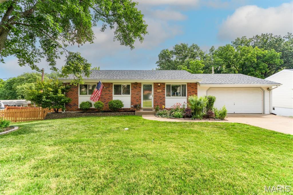 Open House Sunday July 12 from 1-3!!   Lovely corner lot home with 4 bedrooms and 2 full baths with an oversized TWO car garage on a beautifully landscaped and fully fenced yard!!  Beautiful hardwood floors on the main level and bedrooms.  The kitchen features ceramic flooring, extra pantry and cabinet space and a breakfast bar with nice and neutral backsplash.  The walk out lower level is fully finished with a family room area and spacious bedroom and full bathroom.   The over-sized TWO car garage features ample room for a work area.  The roof is approximately 3 years old.  You'll love the outdoor areas of home and the special attention to the plants and gorgeous flowers.  Convenient location in the desirable Mehville area.  This home was been lovingly and well maintained. This is a gem!!