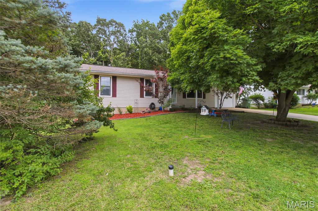 Welcome home to this well-maintained 3-bedroom, 1.5-bath property that offers comfort, convenience, and space to enjoy everyday living. Situated on a level lot with a fenced backyard, this home provides the perfect setting for relaxing evenings, weekend gatherings, or letting pets and children play freely. Inside, natural light fills the spacious kitchen and dining area, creating a warm and inviting atmosphere for meals and entertaining. The comfortable living room offers a welcoming place to unwind, while the versatile laundry and utility room adds extra functionality to fit your lifestyle. Three generously sized bedrooms provide plenty of room for family, guests, or a home office. Recent updates, including a new HVAC system, offer added peace of mind, while the attached one-car garage provides convenient storage and parking. Whether you're a first-time homebuyer, looking to downsize, or searching for a smart investment opportunity, this property is full of potential. Schedule your private showing today and see all this home has to offer!