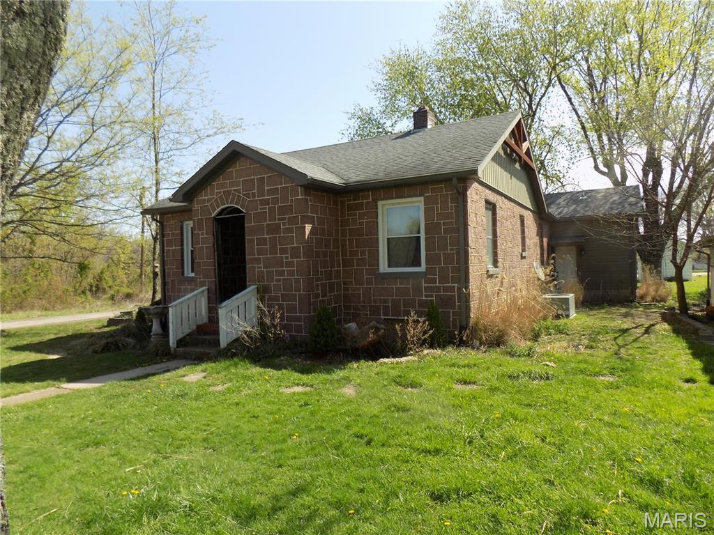 Nice, older granite home, that has been remodeled, with wood floors, 3 bedrooms, 2 baths, central air and heat, fireplace in master bedroom, kitchen with some appliances, and ladder to loft detached garage, small pond, and additional building that was used as "antique store", home has full basement, and drilled well.  Property being sold in "As Is" condition with seller not making any repairs, Buyer can have a inspection done for their own satisfaction