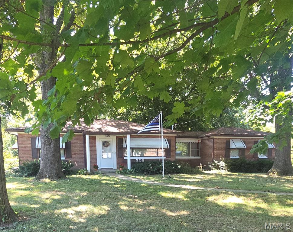Welcome Home to this brick mid-century modern home featuring stylish updates! Kitchen has been, totally, remodeled in the past 2 years and now has quartz countertops, farmhouse sink and 6 burner gas Cosmo stove/oven. And built-in wine/beer cooler. Original hardwood floors in living room and 2 bedrooms have been beautifully refinished. Vintage tile in the main bathroom. Two bedrooms on the main floor and a 3rd non-conforming bedroom in lower level that Seller's have been using for their room. It has walk-out access to the backyard. Full bathroom in lower level with soaking tub, 2 sinks and plenty of room. Family room and laundry area complete the lower level. Dutch door in the kitchen leads to a mud room with a large pantry recently added by Seller's. Two car attached garage. Step out the back door and you will see 1.79 Acres!!! Owner's report seeing deer, eagles, a ground hog and raccoon at the back of the property. A large, covered pavilion doubles as a carport or an outdoor entertaining/relaxing area. Seller will leave the table and 2 benches currently in the pavilion. An above ground swimming pool was just added this summer. And to the back of the property is a wooden play/clubhouse with a zip line!!!  This property includes two parcels number:  07-10.0-412-013 and 07-10.0-412-014. There's a neighborhood Facebook page to keep everyone up to date! Seller's to provide a $2,000 Credit at Closing, with a full-price offer, to assist with finishing sleeping area and bathroom in basement. Contact your favorite Real Estate Agent for a tour of this unique property! Thank you.