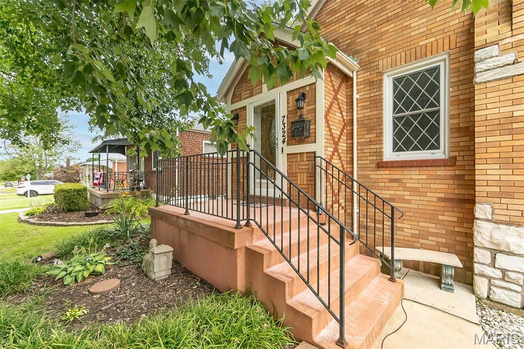 Rare Shrewsbury Unicorn this all-brick 1.5-story gem features a massive 3-car detached garage (30x24) PLUS a separate 12x14 lofted workshop shed, a charming 8x12 cottage playhouse and a whole-house generator. Situated on a double lot with a white vinyl privacy fence, this is the ultimate retreat for car enthusiasts, woodworkers, or those needing a home-based studio.  Inside, the main level radiates warmth with gleaming hardwood floors and a cozy gas fireplace. The heart of the home is the refreshed kitchen, featuring crisp white cabinetry with soft-close drawers, granite countertops, and stainless steel appliances. You’ll love he step-down breakfast nook, perfect for morning coffee. Rounding out the main level are two bedrooms and an updated full bathroom. The upper level offers two additional bedrooms and a shared hall bathroom, with one bedroom boasting a versatile bonus area ideal for a nursery, reading nook, or walk-in closet. The living space extends into the partially finished basement, which has been thoughtfully designed to include a dedicated home office, a quiet sleeping room, and a large recreation area, alongside storage and laundry facilities. With every major system updated this home offers the perfect blend of classic St. Louis charm and modern efficiency. Maintenance-free living with a 2025 roof and 2016 HVAC!