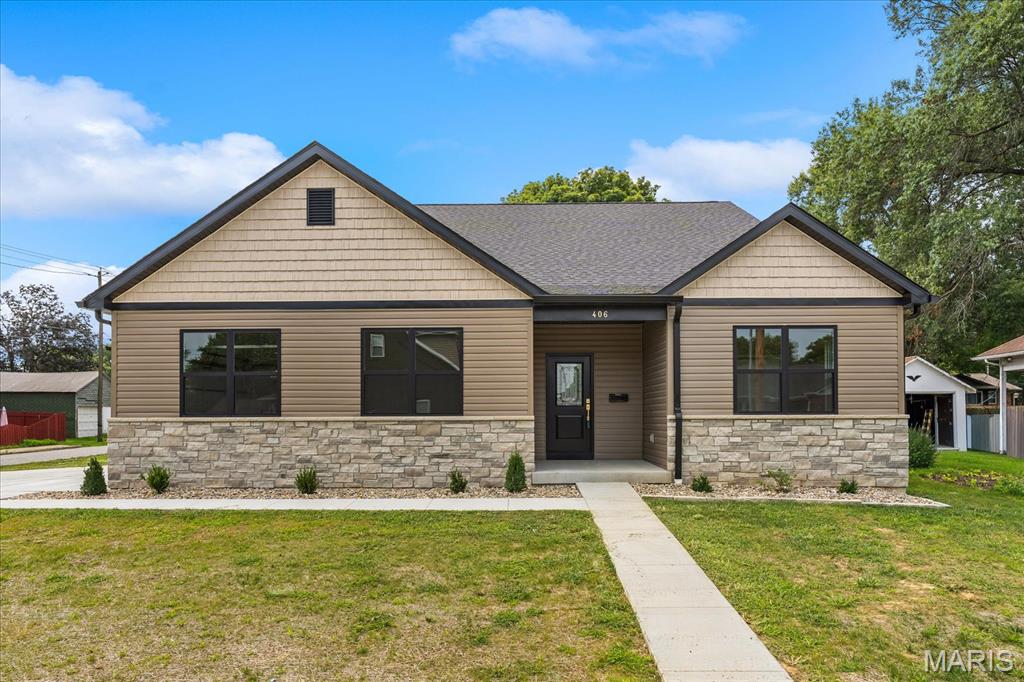 Modern new construction meets thoughtful custom design in the heart of Millstadt! Offering over 2,100 square feet of beautifully finished living space, this 3-bedroom, 2-bath home was built with both style and functionality in mind. The open-concept layout features a spacious living area with a gas fireplace, luxury finishes, and a stunning kitchen complete with granite countertops, under-cabinet lighting, functioning vent hood, oversized island, custom pantry, and all appliances included.

The private primary suite offers a custom tiled shower, impressive walk-in closet with built-ins and full-length mirror, plus direct access to the screened-in patio — perfect for morning coffee or letting pets out with ease. Additional highlights include custom closets throughout, a drop zone with bench and hooks, laundry room sink, and added flooring supports for enhanced stability and reduced squeaking.

Enjoy outdoor living with a screened patio featuring ceiling fans, an additional concrete grilling pad, seeded yard, extra exterior outlets, and attached 2-car garage with a dedicated refrigerator/freezer circuit. The full basement is already framed with rough-in plumbing for a future bathroom, offering incredible potential for added living space. Generator wiring is also in place for future hookup.

This thoughtfully designed Millstadt home blends quality craftsmanship, modern convenience, and everyday comfort in one impressive package.