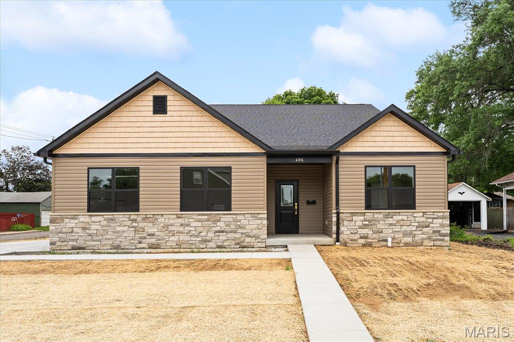 Modern new construction meets thoughtful custom design in the heart of Millstadt! Offering over 2,100 square feet of beautifully finished living space, this 3-bedroom, 2-bath home was built with both style and functionality in mind. The open-concept layout features a spacious living area with a gas fireplace, luxury finishes, and a stunning kitchen complete with granite countertops, under-cabinet lighting, functioning vent hood, oversized island, custom pantry, and all appliances included.

The private primary suite offers a custom tiled shower, impressive walk-in closet with built-ins and full-length mirror, plus direct access to the screened-in patio — perfect for morning coffee or letting pets out with ease. Additional highlights include custom closets throughout, a drop zone with bench and hooks, laundry room sink, and added flooring supports for enhanced stability and reduced squeaking.

Enjoy outdoor living with a screened patio featuring ceiling fans, an additional concrete grilling pad, seeded yard, extra exterior outlets, and attached 2-car garage with a dedicated refrigerator/freezer circuit. The full basement is already framed with rough-in plumbing for a future bathroom, offering incredible potential for added living space. Generator wiring is also in place for future hookup.

This thoughtfully designed Millstadt home blends quality craftsmanship, modern convenience, and everyday comfort in one impressive package.