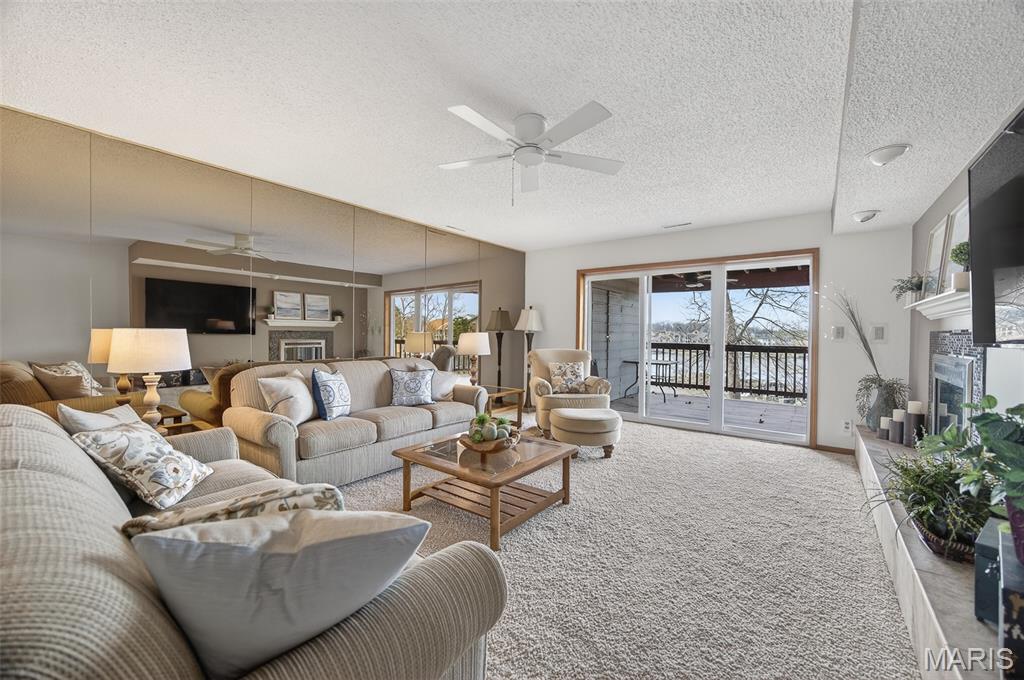 Come see this perfectly laid out condo that comes fully furnished, perfect for vacation rentals or your own special getaway place! This home was very well taken care of and features large deck space and awesome views of the amazing Lake of the Ozarks. There are two bedrooms and two full bathrooms, beautiful functional kitchen, dining area with tons of natural light and gorgeous living room space featuring mirrors and even a fireplace! Each bedroom has their own access to the large deck space, where you can catch the wonderful view of the Lake! Spend some time outside as it is a peaceful haven, just as much as the inside is! This is a main level unit with only a few steps to the door and ground level parking! Just minutes from so many local amenities right near the heart of Osage Beach and Lake of the Ozarks! Projected Theme Park to be built right across the street, so this will be an excellent place to stay while vacationing! Video Tour Available!