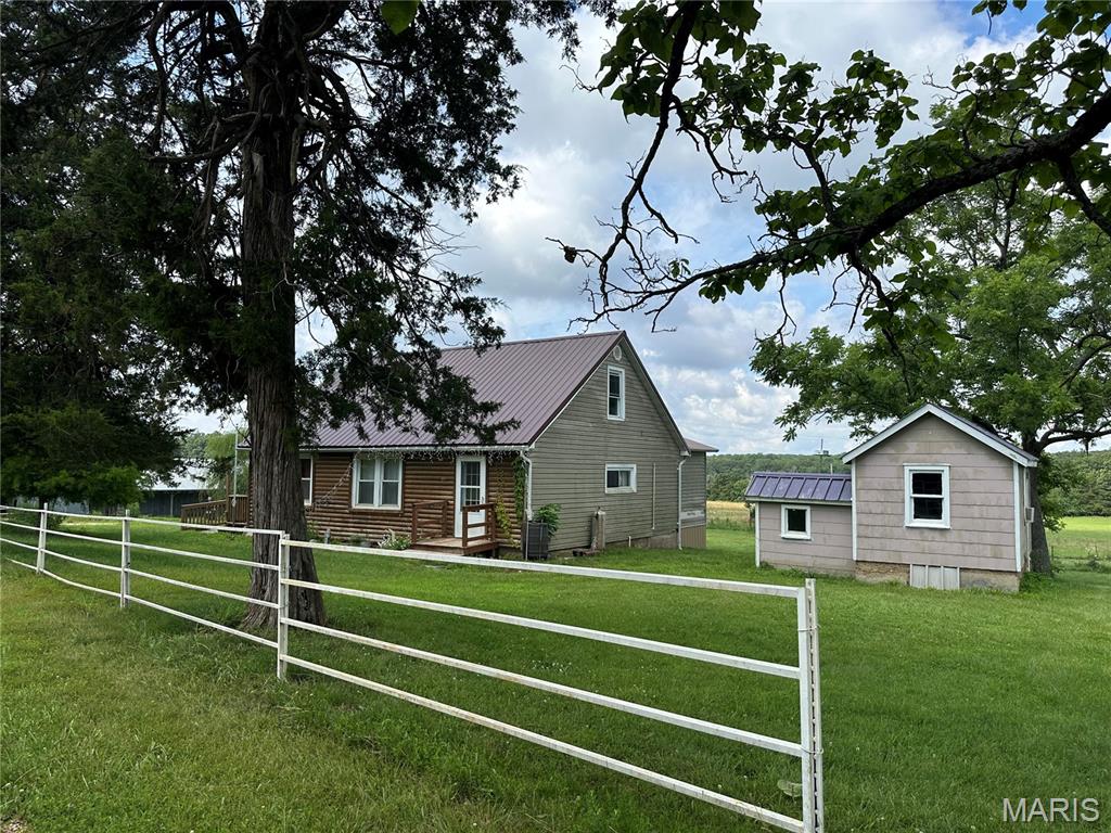 COUNTRY ROADS TAKE ME HOME…
Farmhouse & Barn on 5 Acres – If you’ve been searching for a property with character, acreage, and the opportunity to make it your own, this charming 1½-story farmhouse is full of possibilities. Situated on 5.0 acres, the property also includes a one-room ranch-hand living quarters and a traditional barn, offering ample space for hobbies, storage, livestock, or future improvements. Property is being sold AS IS. Seller will make no repairs. All inspections are for the buyer’s informational purposes only. If you’ve been dreaming of a true fixer-upper with rural charm and unlimited potential, don’t miss this opportunity!