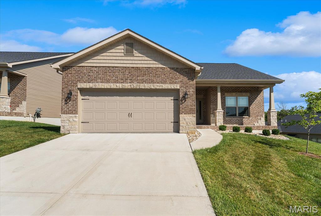 DOWNSIZING AND LOOKING FOR A WORRY-FREE LIFESTYLE!! This better-than-new 3-bed, 3-bath home in Tanglewood’s 55+ community of Villa Valley offers the space, comfort, and freedom you’ve earned. Enjoy peaceful mornings on your screened-in composite deck overlooking landscaped grounds, or host friends in the finished lower level with a full bath and guest space.  Built in 2024, this home features luxury finishes throughout including quartz countertops, stainless appliances, upgraded lighting, and custom window treatments. With over 2,200 sq ft of finished living space, a spacious primary suite with a large shower with bench seat,  a customized walk-in closet next to the laundry room, and no yardwork, life here is easy.  At just $125/month, you'll have lawn care, snow removal, front irrigation, and seasonal yard clean up handled for you...all part of your new worry-free lifestyle!  Villa Valley is nestled in Tanglewood, a picturesque community with miles of sidewalks, nature paths, trails, stocked ponds, a playground, and golf-cart friendly streets. Convenient location just 10 minutes to shopping and restaurants and 20 minutes to Scott AFB and downtown St. Louis. Transferable lifetime waterproof warranty available.