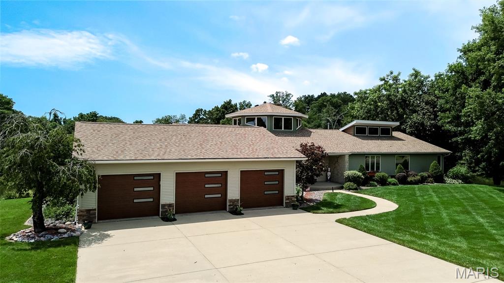 Welcome to your dream lakefront home, where breathtaking water views and modern updates come together in a beautiful setting. Nestled on a scenic 77-acre lake, this spacious 5-bedroom, 4-full-bath home offers the perfect blend of comfort, style, and year-round recreation.
Designed for both everyday living and entertaining, the home features an open floor plan filled with natural light, a beautifully updated kitchen with granite countertops and an oversized island, and expansive living spaces that showcase stunning lake views. Step outside to enjoy your private waterfront oasis with an extended  dock, making it easy to spend your days boating, fishing, kayaking, or simply relaxing by the water.  This meticulously maintained home has been thoughtfully updated over the years, giving buyers peace of mind and modern conveniences.  Recent Updates Include:
2021
Fresh interior paint throughout,
New carpet,
Granite kitchen island countertop,
2022
New air conditioning system,
Exterior lighting,
Dock extension with new cover,
UV window tinting on windows and sliding doors,
Granite waterfall countertop at wet bar/reservoir,
2023
Lower-level bathroom renovation,
Tiled lower-level hallway,
Painted basement ceiling and walls,
Professional landscaping improvements,
2024
New garage doors,
New roof,
New refrigerator,
2025
Added basement storage room with new wall,
Freshly painted basement walls,
Primary bathroom updates including new countertop-faucets-paint-blinds and curtain,
Furnace heat exchanger and ignitor replaced.
Whether you're looking for a full-time residence or a weekend escape, this exceptional waterfront property offers an incredible opportunity to enjoy lake living at its finest. With extensive updates, spacious accommodations, and a prime location on a beautiful 77-acre lake, this move-in-ready home is ready for its next owners.
Schedule your private showing today and experience the lake lifestyle you've been dreaming of!