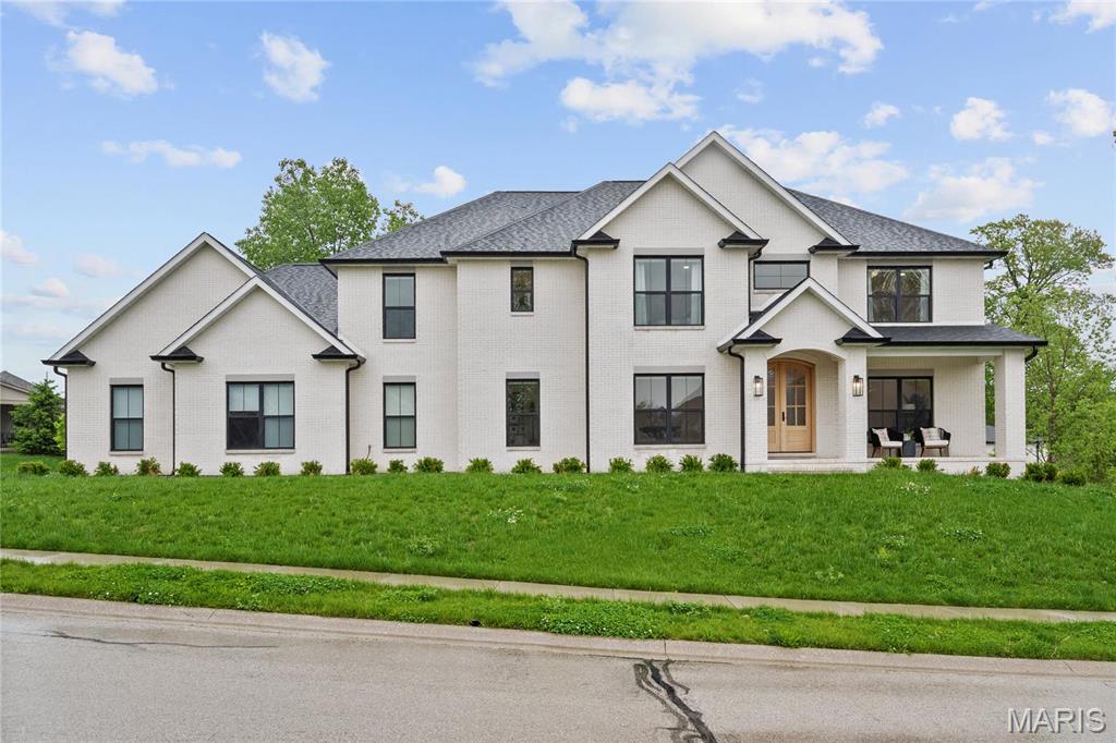 STUNNING CUSTOM HOME IN THE DESIRABLE LOCATION OF THE FAIRWAYS OF FAR OAKS! Built in 2022, this immaculate 2-story home combines timeless craftsmanship w/ luxury upgrades like Whitestone brick exterior. Featuring a spacious floor plan, it offers 5 bedrooms & 5 bathrooms. The primary suite is located upstairs, but the main level also features a spacious bedroom w/ its own private bath-perfect to use as a guest room or in-law suite. You'll love the bright, open layout w/ hickory hardwood floors, cozy gas fireplace w/ built-in's, formal office w/ glass doors & a large breakfast nook. The chef's kitchen is a dream w/ floating shelves, double ovens, gas range w/ custom hood, coffee bar, oversized fridge & a walk-in pantry w/ counter space. The walk-out basement is ready to finish to your liking, including a rough in for a future bath & wet bar. Other highlights include zoned HVAC, 2 tankless water heaters, plaster walls, custom mudroom, side-load garage & covered deck. Too much to mention!