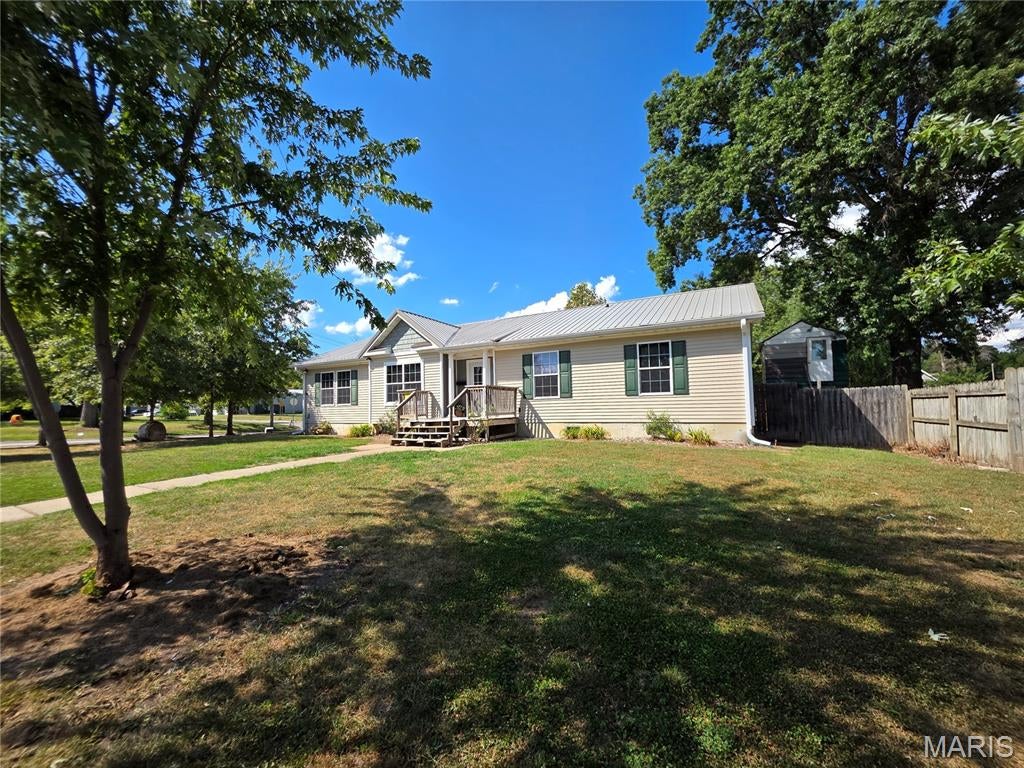 Welcome home to a property where the major updates have already been completed, leaving you the opportunity to add your own finishing touches and unlock its full potential! This beautifully remodeled three-bedroom, two-bath home features a desirable split-bedroom floor plan, completely updated interior, and an inviting open-concept living, kitchen and dining area. The kitchen offers new appliances and a large island, while the utility room includes a new front-load washer and dryer that stay with the home. Additional improvements include a newer heat pump HVAC system and newer metal roof. Outside, the impressive 30x40 detached Quonset-style shop provides concrete flooring and electricity, perfect for hobbies, storage, or workspace. A separate two-story storage building offers even more possibilities and would make an amazing playhouse, studio, or creative space. So much has already been done--now bring your vision and make it your own!