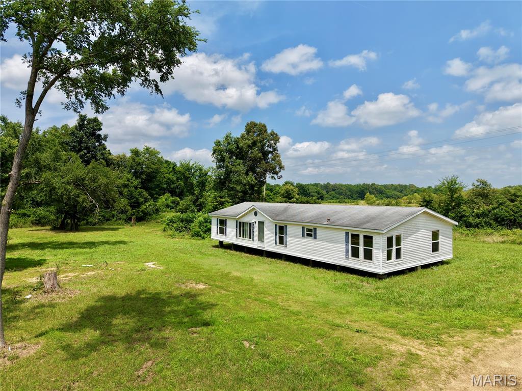 Discover the perfect blend of country living and convenience at 3868 State Highway 21 North in Doniphan! Situated on approximately 5+/- acres, this versatile property offers endless possibilities just minutes from town and the beautiful Current River. Whether you're dreaming of building your forever home, creating a small development, dividing the acreage, or updating the existing home with a few personal touches, this property is full of potential. Electric and water are already available, making it even easier to bring your vision to life. Enjoy peaceful surroundings, room to roam, and quick access to shopping, dining, schools, and some of the area's best floating, fishing, and outdoor recreation. Opportunities like this don't come along often - make your move and turn this property into exactly what you've been looking for!