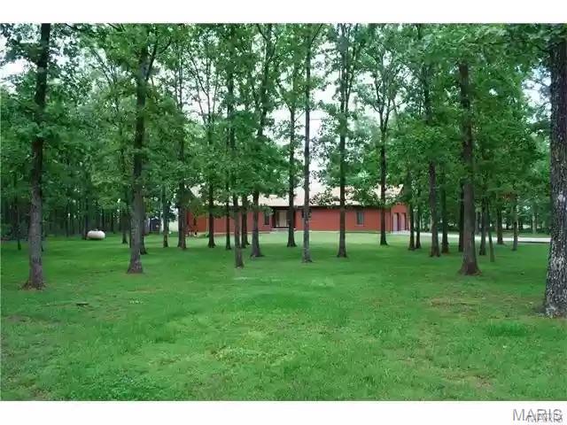 Very nice cedar-sided home nestled on 7.85 acres m/l offering a private setting with scenic Ozark views. This well-maintained property features 3 bedrooms, 2 baths, a full basement, and a 2-car attached garage. Enjoy outdoor living with large decks overlooking the peaceful surroundings. The property is mostly fenced and includes a large fenced area perfect for dogs or pets. A spacious 30x50 shop with two garage doors and a finished interior provides endless possibilities for hobbies, storage, workspace, or equipment. Conveniently located off Dixon Road with frontage along Hwy 137, this property offers both privacy and accessibility. Outdoor enthusiasts will appreciate being within reach of trout fishing, floating, and recreation opportunities at Montauk State Park, located near the headwaters of the Current River. River access and outdoor recreation can also be found at Boiling Spring Access on the Big Piney River, offering boating, fishing, and picnic opportunities. Abundant wildlife and nearby conservation and recreational areas make this a great place to enjoy country living and the outdoors.