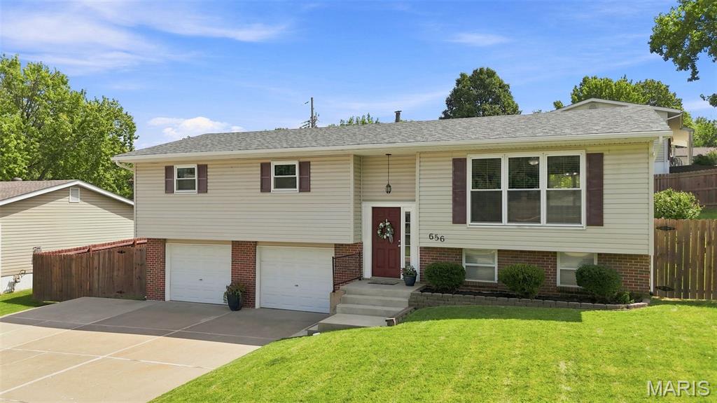 Welcome to 656 Nancy Drive! This well-cared-for split foyer home sits on a large corner lot and features a brand-new roof and brand-new paint, making it truly ready-to-go!
You'll find 1,788 square feet of comfortable living (public records), including three generously sized bedrooms, two full bathrooms and a finished lower level with even more room to relax and spread out. The generously sized kitchen offers the option for a quick and easy eat-in area with the addition of a small table or breakfast bar, while the separate dining room provides the perfect setting for meals and entertaining.
The main living area is filled with natural light thanks to three floor-to-ceiling windows, highlighting the beautiful wood flooring. Each bedroom features a custom closet system, making organization a breeze. Storage is abundant throughout, with hall closets, built-in storage in the laundry room and other smart storage options.
Outside, is a large, private backyard with a big patio and newer privacy fence. And then there's the parking! The truly oversized two-car garage offers exceptional room for parking, storing and more, plus the expansive driveway has a full additional parking lane for multiple extra vehicles—or even an RV or boat! 
Talk about location! This home offers easy access to several nearby parks, close by dining options, shopping and entertainment on Historic Main Street St. Charles and the Streets of St. Charles. Everyday conveniences, grocery shopping and schools are close by, while Lindenwood University is just minutes away. Commuters will appreciate convenient access to Hwy 70, Hwy 364 and Hwy 370, and Lambert International Airport is approximately 18 minutes away. It’s a location that makes getting where you need to go—and enjoying where you live—easy! BONUS FEATURES! The Ring Doorbell and refrigerator stay with the home; the kitchen sink features a water filtration system for fresh, filtered water right at your fingertips; enjoy the convenience of a MyQ smart garage door opener system—just a few more thoughtful extras that will make you want to call this house your home!