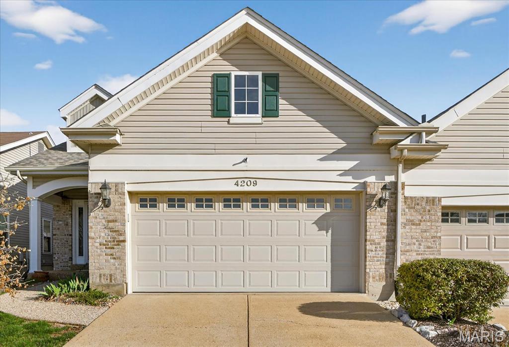 Welcome to 4209 Consett—a charming 1.5-story villa blending comfort, style, and modern updates. This 2-bedroom, 2.5-bath home features vaulted ceilings, hardwood floors, and abundant natural light. The main floor primary suite offers a walk-in closet, bay window, ceiling fan, and a luxurious en-suite with a clawfoot tub and chandelier. The updated kitchen, complete with included appliances, is perfect for any home chef. Adjacent to the kitchen, a cozy breakfast room with a bay window invites you to enjoy your morning coffee while overlooking the patio, seamlessly connecting indoor and outdoor living. Plus, the convenience of a main floor laundry room makes everyday living a breeze. Upstairs, you’ll find a spacious second bedroom with its own full bath and a versatile loft area ideal for a home office or reading nook. Newer Anderson Windows, some even crank out for easy access and cleaning.
Outside, the level patio creates the perfect space for entertaining or unwinding as the sun sets. Additional highlights include a full, unfinished dry basement (never been water in there) lower level, oversized 2-car garage, built-in beam vacuum system, and included washer and dryer for move-in ease.