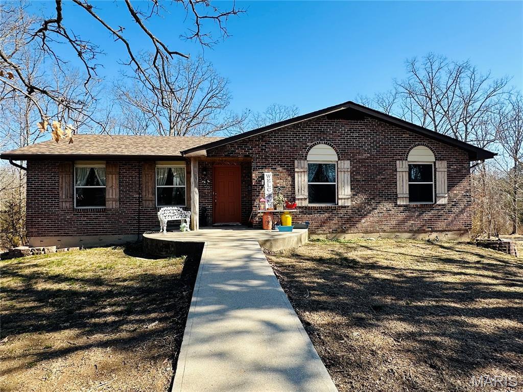Welcome to this spacious and beautifully updated 4 bedroom, 2.5 bath home situated on 4.22 acres m/l — offering the perfect blend of privacy and convenience within city limits while tucked away on a quiet cul-de-sac.Step inside to find a thoughtfully designed layout featuring generous living spaces and numerous updates throughout. The basement provides flexible living options, ideal for a 4th bedroom, recreation space, or game room to fit your lifestyle needs. A new roof and gutters installed in 2025 add peace of mind for years to come. Accessibility is a standout feature with a no-step front entry and ramp, making entry easy and welcoming for all. The inviting sunroom overlooks the backyard, where you can relax and enjoy the abundant wildlife and scenic surroundings. Outside, this property truly shines with a concrete fire pit with seating that is  perfect for entertaining, plus a large workshop offering excellent space for hobbies, storage, or business use. If you’ve been looking for a spacious home with acreage, updates, and city convenience this one checks all the boxes.