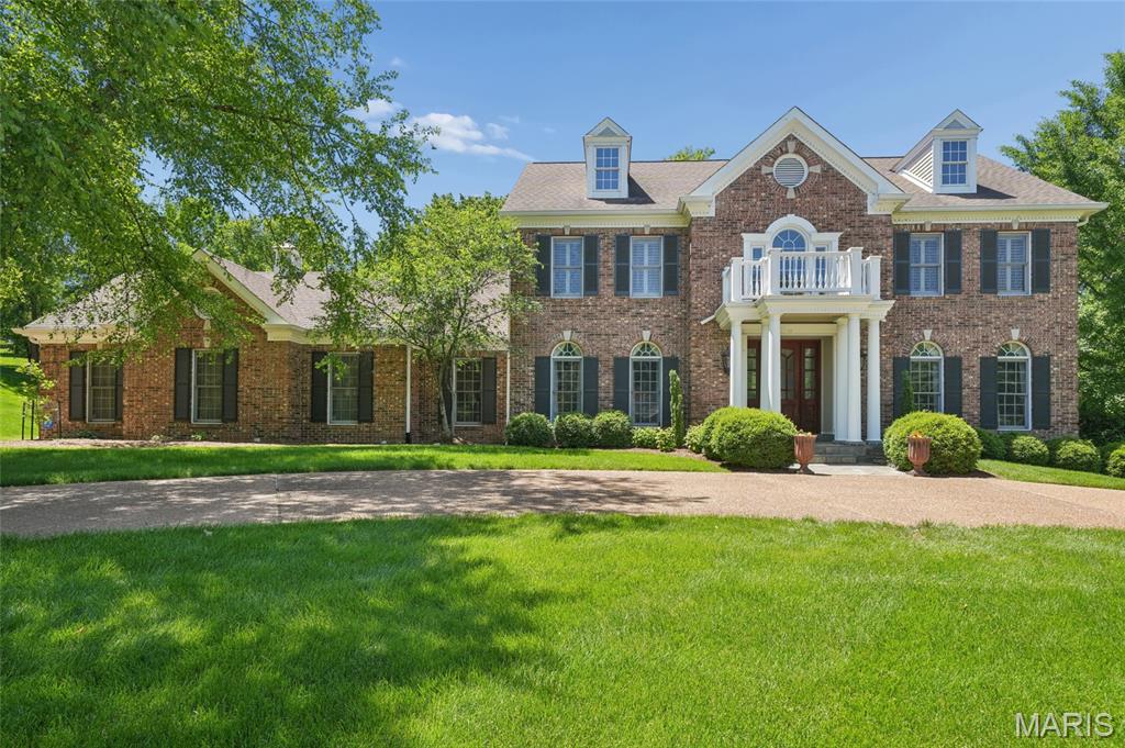 This impeccable two-story home, brick on three sides, sits on a 1.14-acre private lot backing to trees. A circular drive welcomes you to this beautifully maintained property featuring 5 bedrooms and 4.5 baths. The updated kitchen and baths offer modern style and function, while the spacious layout includes a recreation room with a 5th bedroom, fireplace, and wet bar—perfect for entertaining. Enjoy a total of two fireplaces and two wet bars throughout. A stunning T staircase adds architectural charm, complemented by zoned heating and cooling. Relax and enjoy the bluestone patio with a beautiful outdoor stone fireplace, all set in a private, tree-lined backyard. Complete with a sprinkler system and 3-car garage, this move-in ready home is exceptional inside and out.