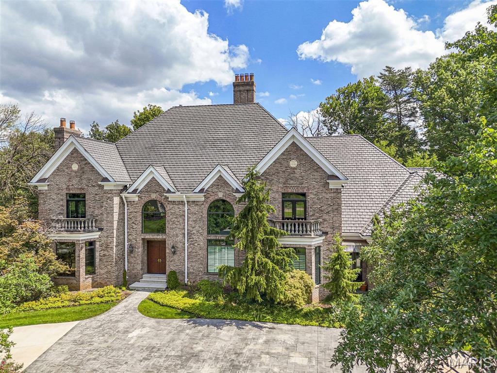 Numerous offers received after price reduction.  Pending without contingencies.  
Now is the moment. Opportunities like this are rare—and seldom repeated. Presenting the original developer’s personal residence, a home crafted without compromise and set on one of the most coveted lots within one of Saint Louis County’s most prestigious communities. 4 car garage for the collector in the family! 

Recently refreshed with thoughtful, high-end updates, this exceptional property is truly move-in ready and poised for its next chapter. From the moment you arrive, the level of quality and intention is unmistakable. Inside, the expansive main level unfolds beautifully, offering an effortless balance of refined daily living and grand-scale entertaining. A newly designed, statement-making kitchen with oversized island anchors the home, flowing seamlessly into the gracious dining room, elegant living room, and a richly appointed library with private office.

The first-floor primary suite delivers a private retreat, complete with a newly remodeled, spa-inspired bath designed for relaxation and renewal. Upstairs, three oversized junior suites provide generous comfort, complemented by a flexible nanny or in-law suite and a walk-up third-floor attic offering abundant storage or future potential.

The daylight lower level is nothing short of extraordinary—an entertainer’s dream featuring a media room, fitness studio, game room, additional office, full guest quarters, kitchenette, and an expansive lounge with direct walkout to the patio. The level, beautifully proportioned lot is perfectly suited for a future pool—ready for your vision.

Outside, every element has been elevated for longevity and performance: a new alternative slate roof, top-tier windows and doors, composite decking, stamped concrete drive, and paver patio. These improvements reflect the caliber of a home built as a personal residence, not a spec property.

Homes of this stature—combining provenance, craftsmanship, location, and scale—are increasingly hard to find. Motivated sellers invite serious interest and thoughtful offers. Schedule your private tour today and experience firsthand why this remarkable property stands apart.

Homes of this caliber, with this history, location, and scale, rarely come to market. Schedule your visit today—this extraordinary property won’t stay hidden for long!