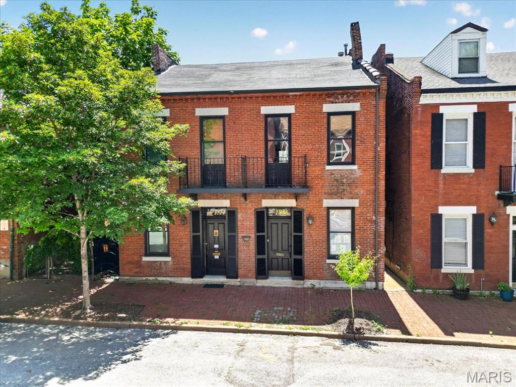 This one is a true show-stopper! Picture all the character of a historic home in one of STL’s most sought-after neighborhoods, complete with top-of-the-line modern updates—all just steps from the Soulard Farmers Market and the iconic Mardi Gras festivities.

Step inside this beautifully reimagined residence to discover a striking interior highlighted by rich exposed brick, refined recycled woodwork, brand-new flooring, and designer lighting throughout. The gourmet kitchen is a chef’s delight, featuring premium quartz countertops, stainless steel appliances, and floor-to-ceiling cabinetry that perfectly balances style and function. Nearby, the dining room features an elegant tin-tile ceiling, an additional serving area with a butcher-block top, and a dual-zone temperature-controlled wine fridge. Notice the classic transom windows and brand-new solid-core doors as you move through the home.

Upstairs, the primary bedroom boasts a spacious walk-in closet and a completely redesigned bath with herringbone tile. A generous second bedroom offers the perfect setup for a home office or gym with tons of natural light, right next to the dedicated laundry room. The fully functional third floor serves as a private guest suite with its own full bathroom, walk-in closet, and stunning views of the Gateway Arch!

The fenced in yard is big and level, and has off street parking for 2 vehicles, including an EV charger already installed.

Designed for effortless entertaining and everyday comfort, this turnkey home puts you minutes from downtown and steps from the best of Soulard.