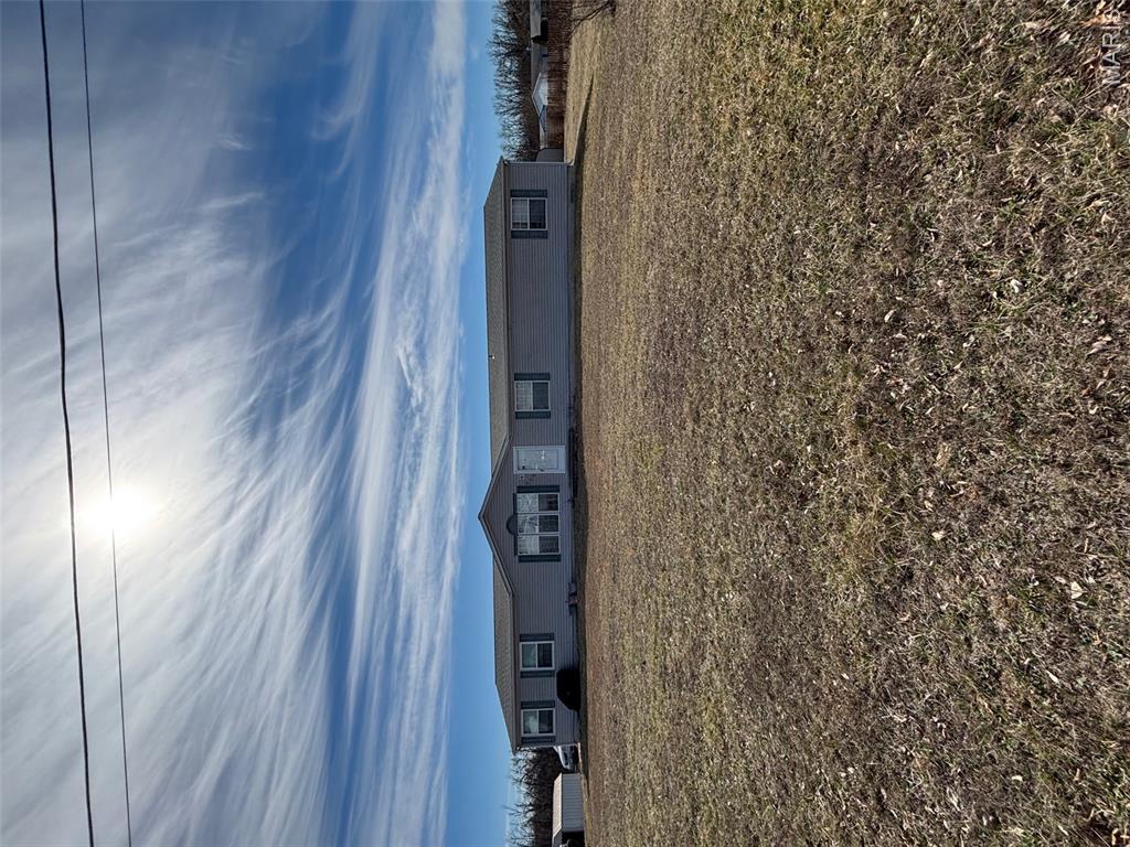 Large 4 bed, 2 bath home on 3.7 acres just outside of Sullivan. Large kitchen, dining & family room with fireplace on concrete foundation. Very nice home with new electric furnace. Land is open and level. 3 nice sheds stay with the home. The home is currently being emptied of all contents and inside pics are to come!