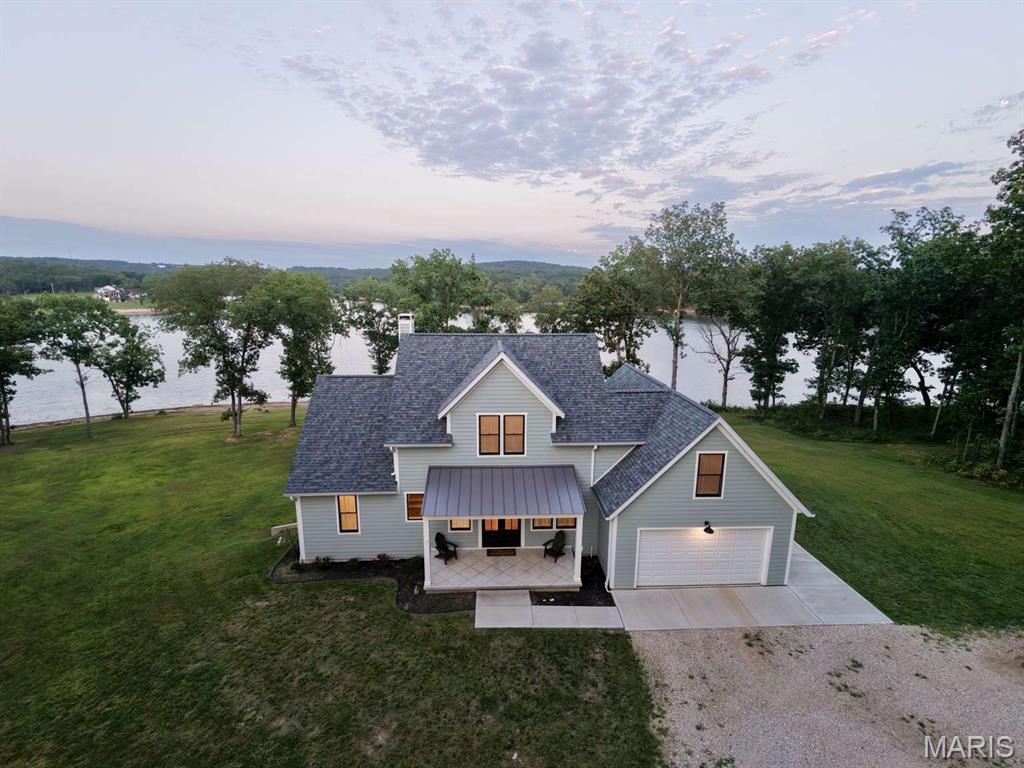 Custom Lake Home on 11.36 Acres

Private lakefront living just outside of town. This custom-built 2-story home sits on 11.36 acres with over 1,400 feet of frontage on Bray Lake, a 103-acre private lake 1 minute from all amenities!

The home offers 2,707 finished square feet with 5 bedrooms and 2.5 baths. Nine-foot ceilings run through all levels including the walkout basement. The kitchen was built around a black walnut island, with oak flooring throughout, an oak stairwell, and a wood-burning stove anchoring the living space. Multiple 8ft French doors open the main level to a lovely deck and covered porch overlooking the water.

Built to last: Hardie fiber cement siding, custom exterior paint, Pella aluminum-clad windows, individually zoned heat pump systems, and a hybrid heat pump water heater to keep operating costs low. The full walk-out lower level adds 1,384 square feet already drywalled with plumbing and electrical rough-ins — finish it for a second living area that easily expands the house to over 4,000 sqft.

Outside, the land is classic Ozark terrain — a mix of woods and cleared ground on an incredible lake point, a private dock, and a gravel beach. Deeded access off Highway 63 means you are minutes from Rolla, Missouri University of Science and Technology, and Interstate 44, yet completely tucked away.

Room to build, room to roam, and water at your back door.
