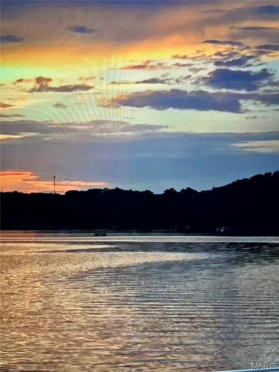 Awesome water front property on Lake Wauwanoka!!!  It features a newer dock for your boat or just to relax and fish off.  This lake community has a lot to offer; sandy beach, pavilion and playground.  There is also a clubhouse for homeowners to rent, which holds 75 family/guests.  The tranquil lake is over 93 acres for your recreational pleasure.  Bring your own builder to transform this spectacular lot into your dream getaway.