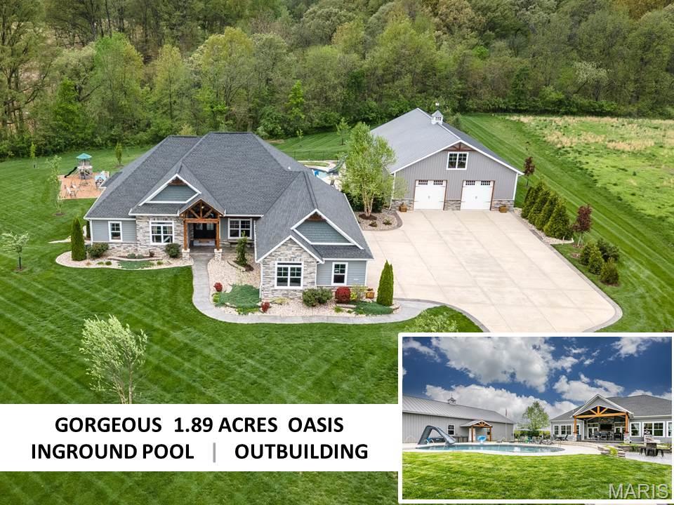 STUNNING & HIGHLY DESIRABLE!  Form, function & artistry converge to create this unparalleled residential experience. Nestled on approx. 1.89 acres, this 4 bed. 3.5 bath w/a finished walkout LL, pool & outbuilding awaits!  From the moment of entry; a brick floor foyer leads to: an office w/wall accent, tall ceilings -some highlighted by wood features, a great rm w/a floor to ceiling stone fireplace, a chef’s kitchen that’s outfitted w/black SS appl., custom cabinets, center island, amazing walk-in pantry- all combine to create a magazine worthy style & finish. Retreat to the primary bed. w/en-suite evoking a spa-like experience w/a soaking tub, walk-in shower, double vanity & more! The expansive LL boasts an array of premier amenities including: heated floors, a family rm, theater rm, game rm, bar area, bed/, full bath, bonus rm & exercise/storage areas. Outside: an over-sized covered patio w/grilling area, an in-ground pool w/water features, putting area, fire bowls , & outbuilding. Additional Rooms: Mud Room