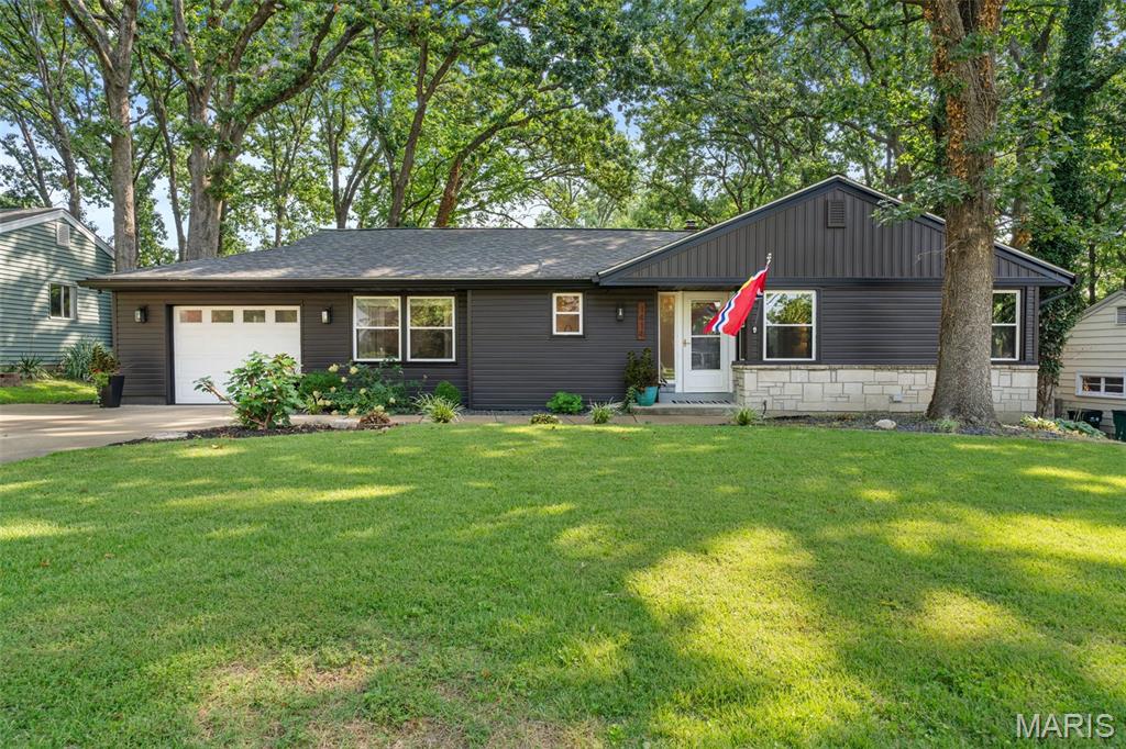 Some homes simply make life feel easier, and this nicely updated 1949 Webster Groves ranch is one of them. Blending classic character with thoughtful modern updates, inviting spaces have been created where everyday moments become lasting memories. Warm wood floors flow throughout, leading to an updated kitchen with white cabinetry, granite countertops, stainless steel appliances, and the dining room, the perfect space to gather with family and friends. The inviting family room features a cozy fireplace and a large picture window overlooking the expansive fenced backyard and patio - an ideal setting for morning coffee, summer cookouts, or evenings under the stars. Four spacious bedrooms offer generous closet space, including double closets in the primary bedroom, while the convenient main floor mudroom area keeps everyday life organized. The finished lower level expands your living space with a large rec room featuring a gas fireplace, a dedicated exercise room, and a full bath, making it perfect for movie nights, game days, guests, or a home office. Newer windows, a brand-new HVAC system, abundant storage, and an attached garage complete this move-in-ready home. Just minutes from the shopping and dining along Big Bend Blvd. and Watson Rd., with quick access to I-44 and located in the acclaimed Webster Groves School District, this is a place you’ll love coming home to.