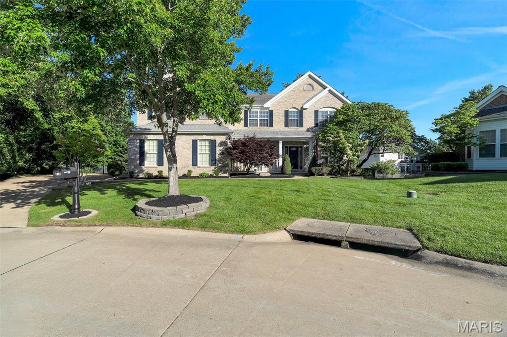 Weekend Open House. June 13th and June 14th. Saturday 12-2pm and Sunday 1pm-3pm. Graciously positioned on a quiet cul-de-sac in coveted Nooning Tree, this distinguished Traditional residence delivers 5,879 square feet of beautifully appointed living — including two above-grade levels plus a spacious finished lower level complete with wet bar, billiards room, and game area. Five bedrooms, five full baths, a half bath, and a three-car attached garage make this an exceptional value in Chesterfield's most sought-after school district.
The main level opens with a welcoming foyer, a private home office behind French doors, and a formal dining room. The light-filled family room features custom built-in bookcases and a fireplace, flowing into an open-concept kitchen with center island, electric cooktop, double wall ovens, quartz countertops, and walk-in pantry. A wet bar, breakfast nook, screened porch, mudroom with custom cubbies, and main-level laundry complete a floor plan built for real life.
Upstairs, all five bedrooms offer walk-in closets. The primary suite showcases an updated bath with a freestanding soaking tub, walk-in shower, and double vanities. Four additional bedrooms and four full baths serve every lifestyle. The finished lower level — with 9-ft+ pour height — adds a billiards room, game area, wet bar, and full bath, making it the ultimate entertaining retreat.
Outside, enjoy a large deck, screened porch, stamped concrete patio, and a level fenced backyard with mature trees. Included: refrigerator, washer, dryer, security system, and whole-home indoor/outdoor audio. Dual-zone HVAC, electronic air purifier, and a shingle roof approximately five years of age round out a home that is truly move-in ready.