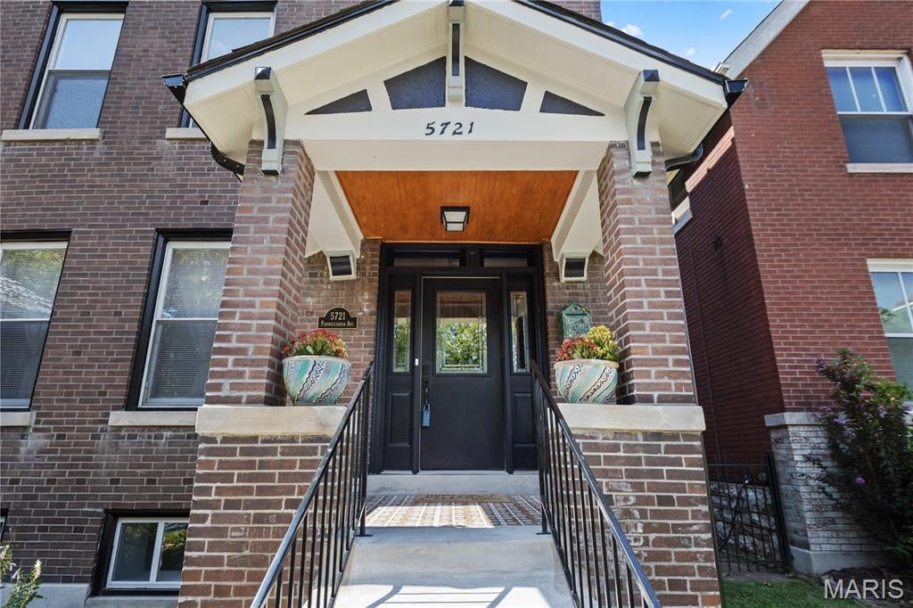 Welcome to a beautifully reimagined piece of St. Louis history, where timeless architectural character meets the comfort and style of a complete modern renovation. This 3-bedroom, 2.5-bath home offers the charm of a historic city residence with virtually everything refreshed for today’s lifestyle. Step inside and immediately appreciate the original woodwork and graceful staircase winding to the second floor. The spacious living room is filled with natural light from big windows and features a sleek electric fireplace, while the separate dining room adds warmth and character with its decorative fireplace—perfect for entertaining or intimate dinners. The completely renovated kitchen blends modern design with everyday functionality, featuring quartz countertops, new cabinetry, stainless appliances, a gas range, and access to the rear deck overlooking the newly landscaped backyard and convenient off-street parking pad. A beautifully updated powder room completes the main level. Upstairs, you’ll find three generous bedrooms, including a private primary suite with a stunning updated bath featuring a double vanity, heated floors, bluetooth and surround sound. A second fully renovated bath serves the additional bedrooms. The improvements continue throughout with a new roof, new electrical panel, new A/C, new flooring, fresh paint, and beautifully renovated kitchen and baths. The clean, freshly painted walk-out basement provides laundry space and plenty of room for storage. Another half bath and extra storage room are an addition in the basement. Historic character. Modern finishes. Major updates already completed. Enjoy the energy and convenience of St. Louis city living in a home that beautifully combines the craftsmanship of the past with the comforts of today—all at an exceptional value under $300,000.
