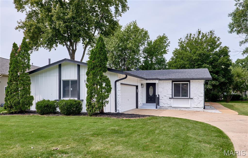 Welcome to this fully renovated 3-bedroom, 3-bath home located in the desirable Lake St. Louis Community Association, offering over 2,500 square feet of finished living space! The main level features a spacious family room with a wood-burning fireplace, creating a warm and inviting gathering space. The brand-new kitchen offers fresh, modern finishes, while the dining area connects seamlessly to the living room, providing an open and comfortable flow for everyday living and entertaining. The primary bedroom features a private en suite bath, while two additional main-floor bedrooms share a beautifully updated full bath with double sinks. The finished lower level adds even more versatility with a large recreation room, sleeping area, and full bath—ideal for guests, a home office, or additional living space. Outside, enjoy a large yard with plenty of room to relax, play, or entertain. Major improvements include a new roof and new windows, along with extensive updates throughout. With over 2,500 square feet of finished space and access to the amenities of the Lake St. Louis Community Association, this move-in-ready home offers an impressive combination of space, updates, and location.